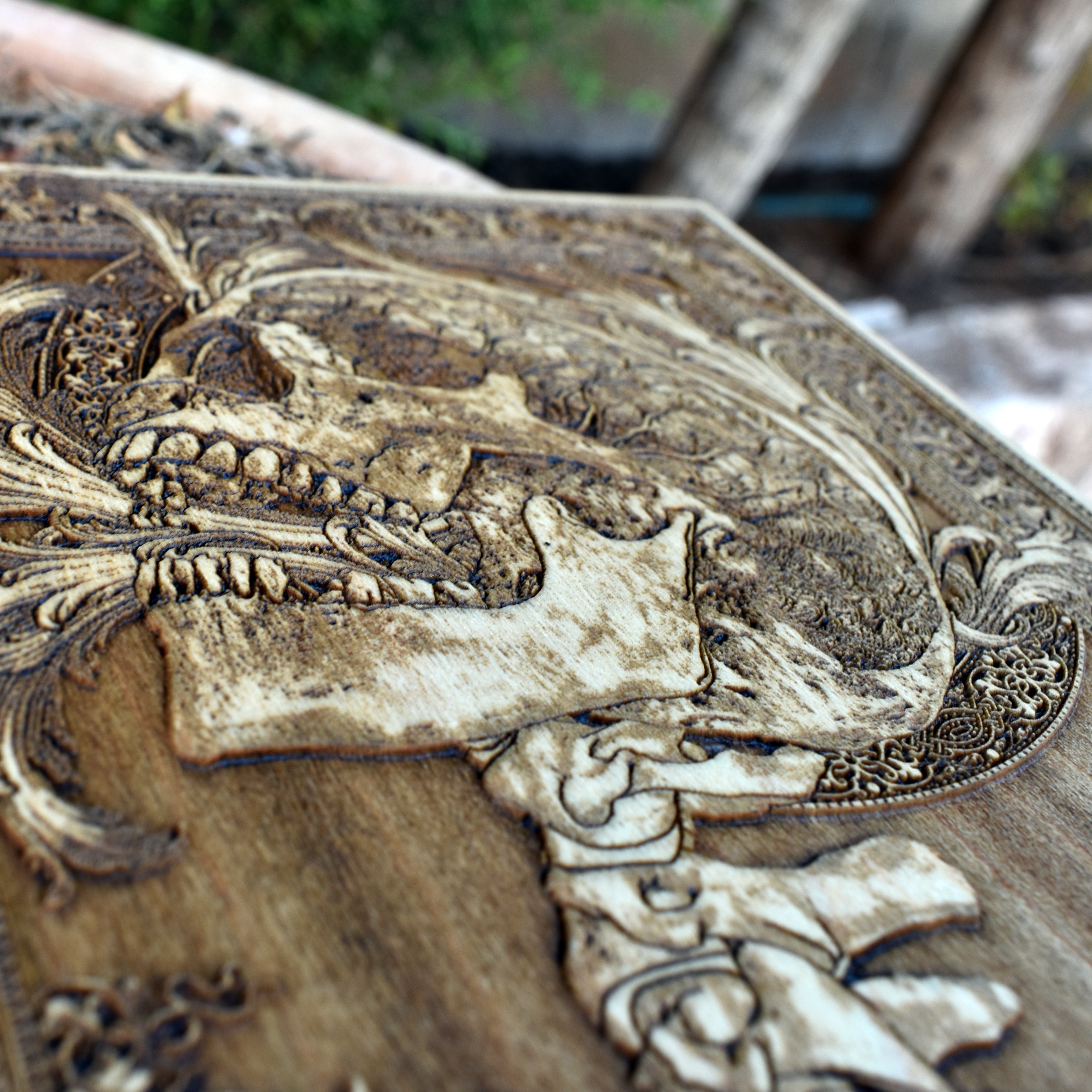 Dark skull wood engraving with detailed spine illustration, perfect for gothic office decor or as a gothic-themed birthday gift.