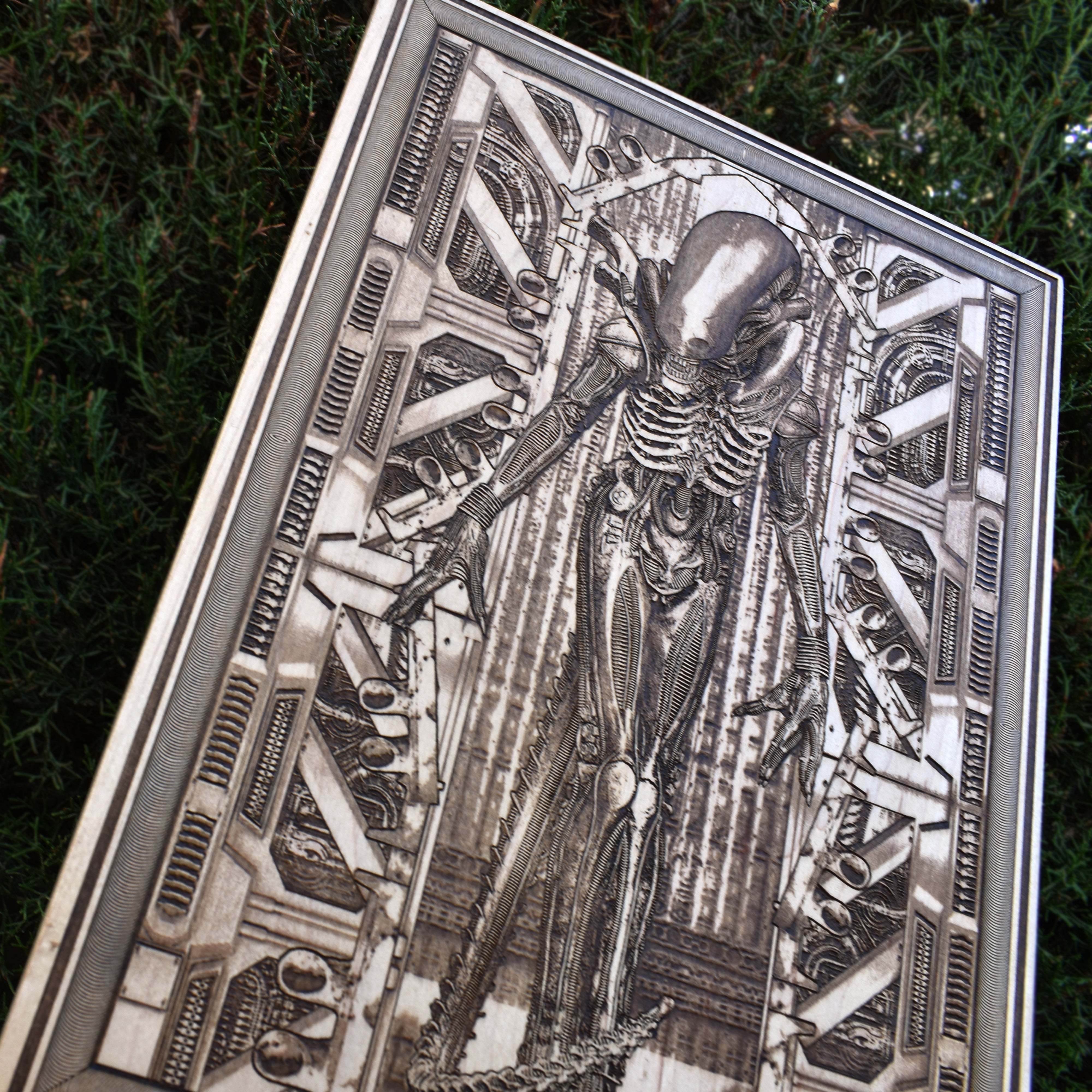 Handcrafted horror wood wall decor featuring Xenomorph