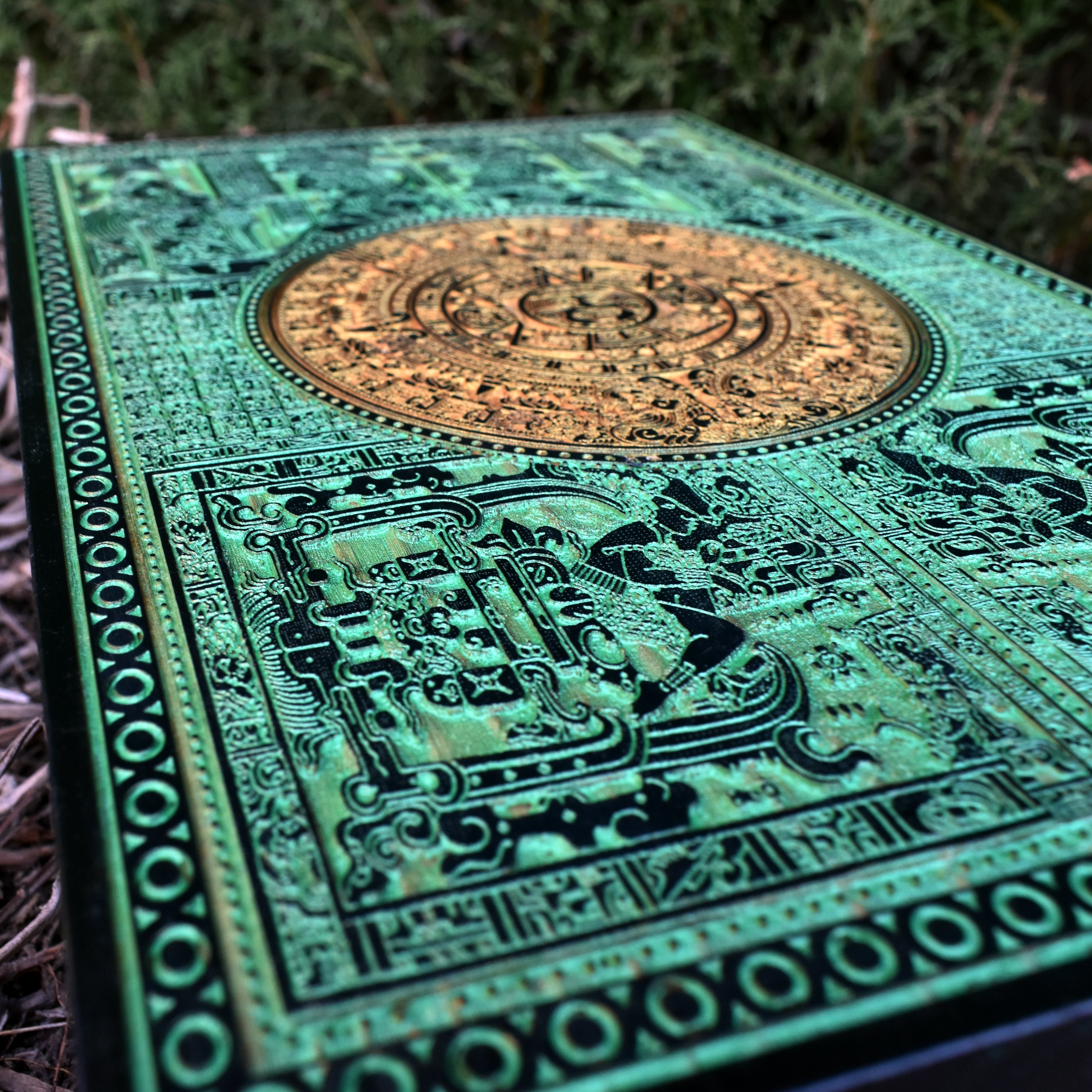 Green Mayan sun calendar wall art with tribal-style wood engraving.