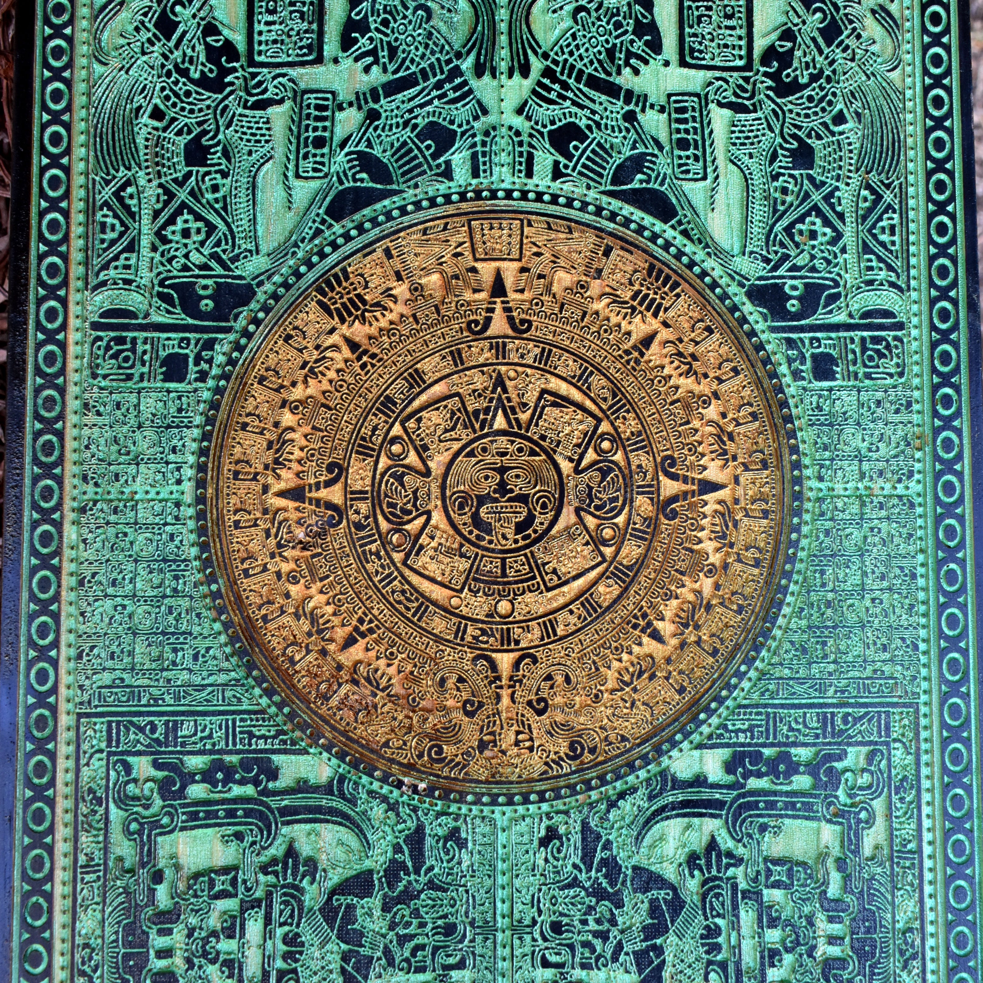 Mesoamerican-inspired green Aztec wall art, engraved on real wood.
