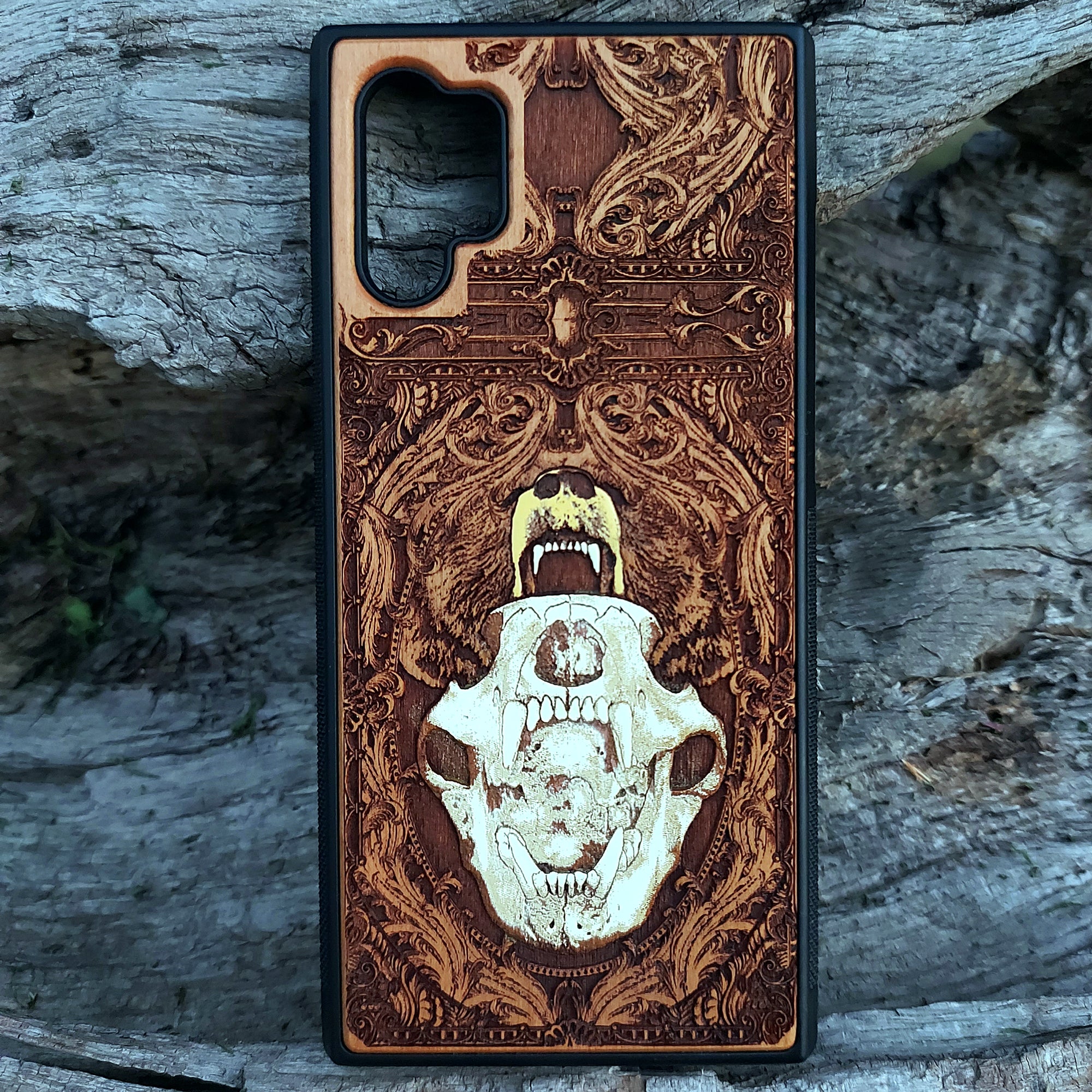 Laser-engraved bear skull design on a wooden phone case, featuring intricate gothic artwork, compatible with iPhone 16, iPhone 15, Galaxy S25, and more.