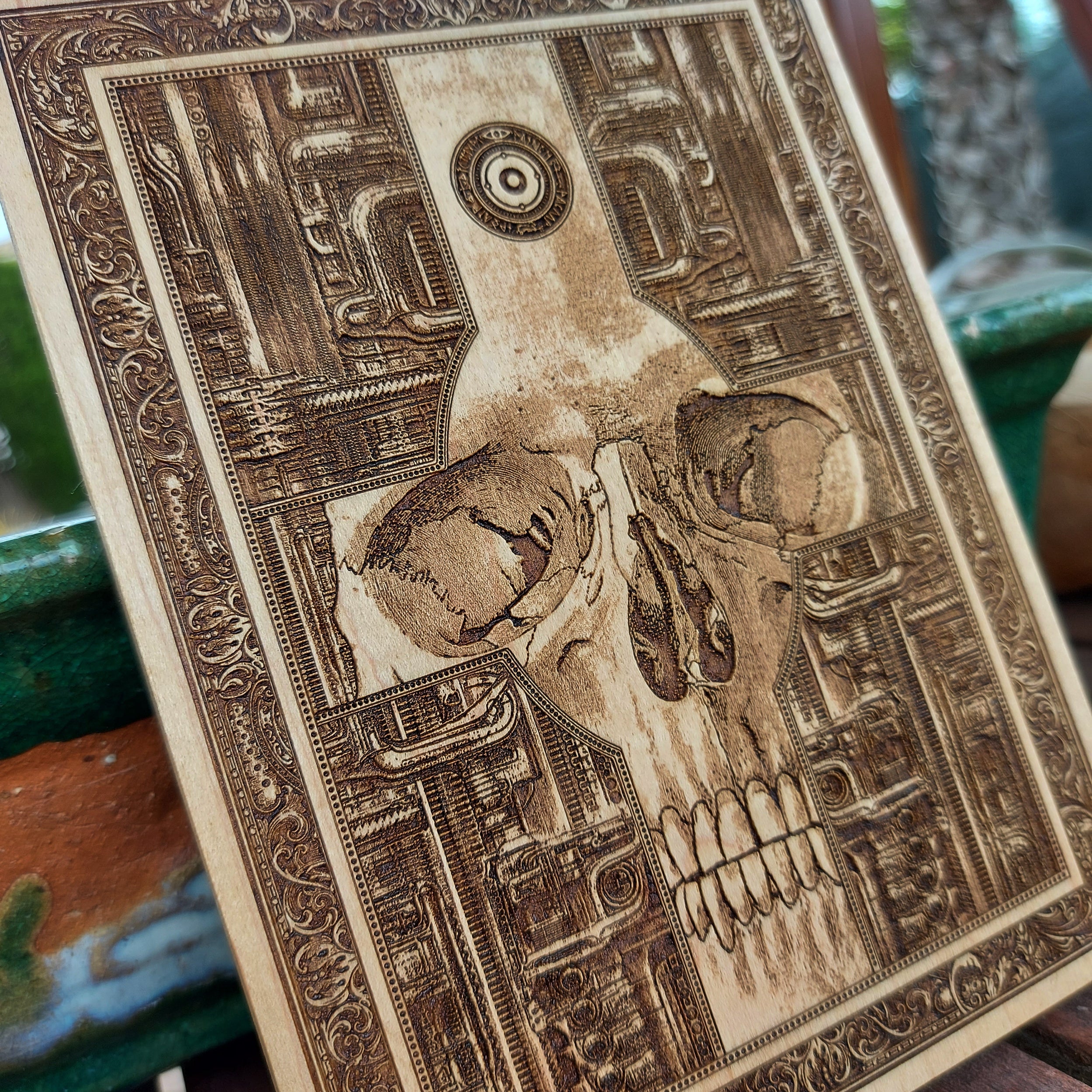 Dark elegance in wood: gothic skull cross wall art with biomechanical details.