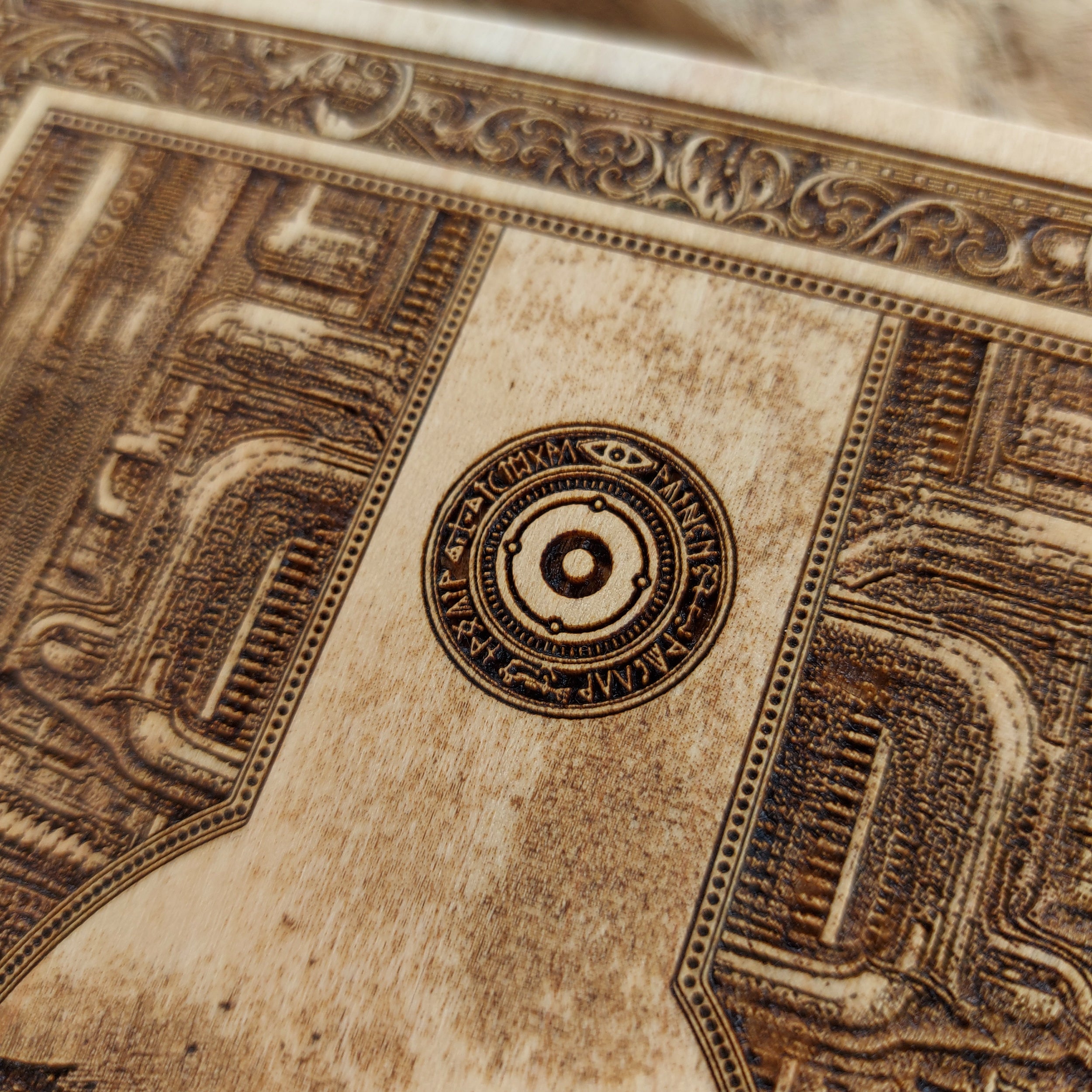 Artisan crafted wood wall art featuring a gothic skull cross and biomechanical elements.