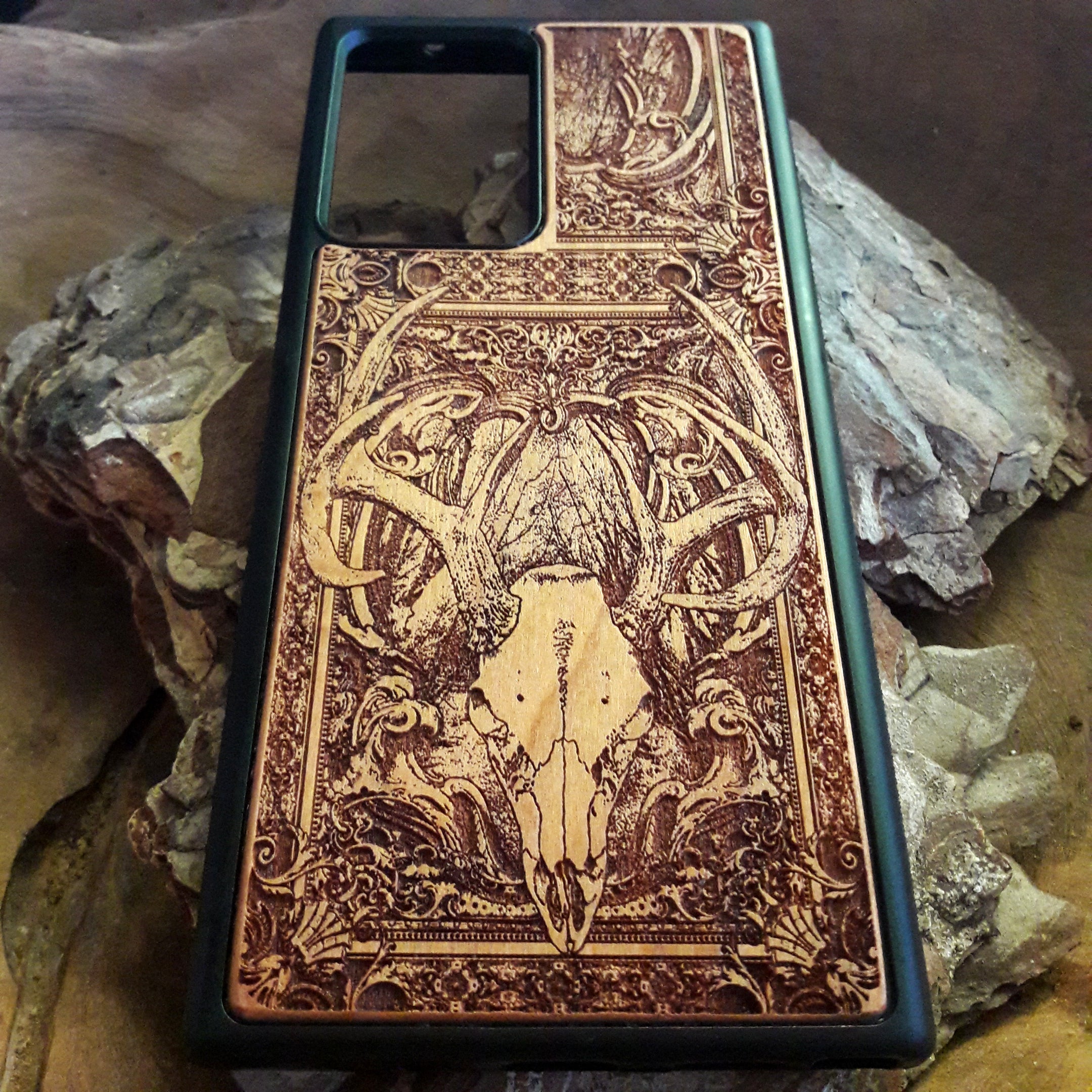 Gothic wood phone case with a hand-painted skeleton design, perfect for iPhone & Galaxy users who love dark art. Durable and stylish.