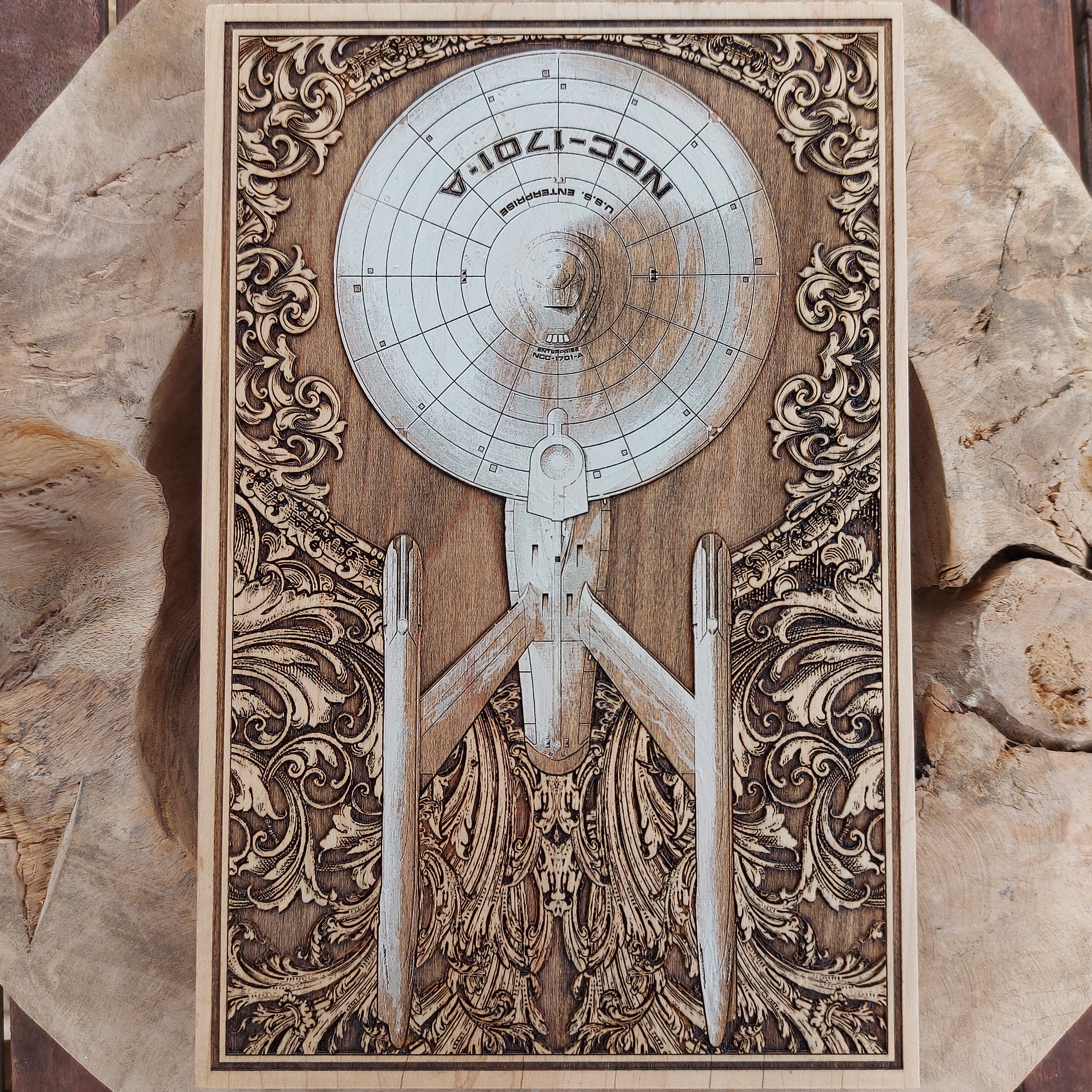 Laser-engraved and painted wood art of starship Enterprise for collectors.