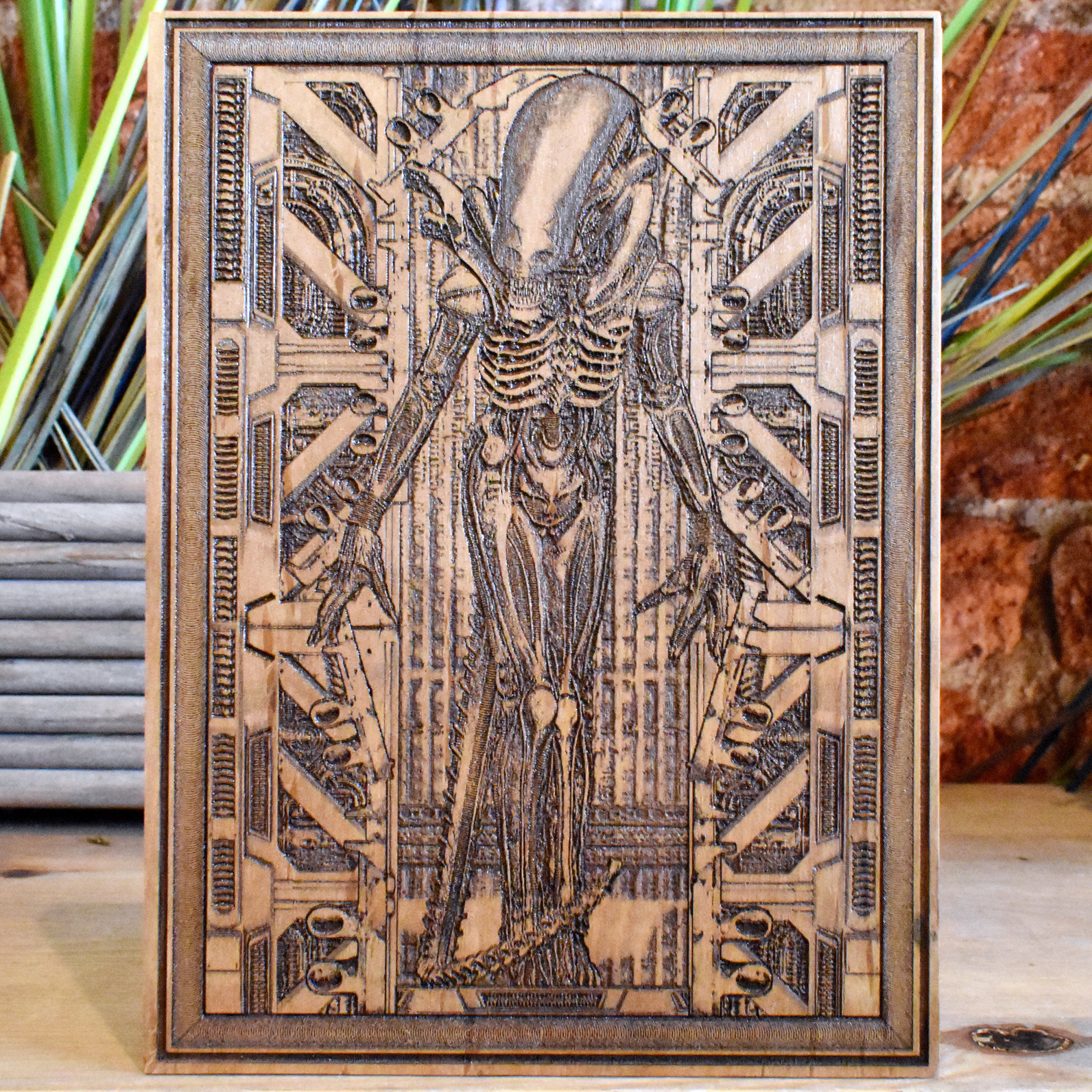 Xenomorph Alien engraved wood wall art, sci-fi horror movie-inspired decor.