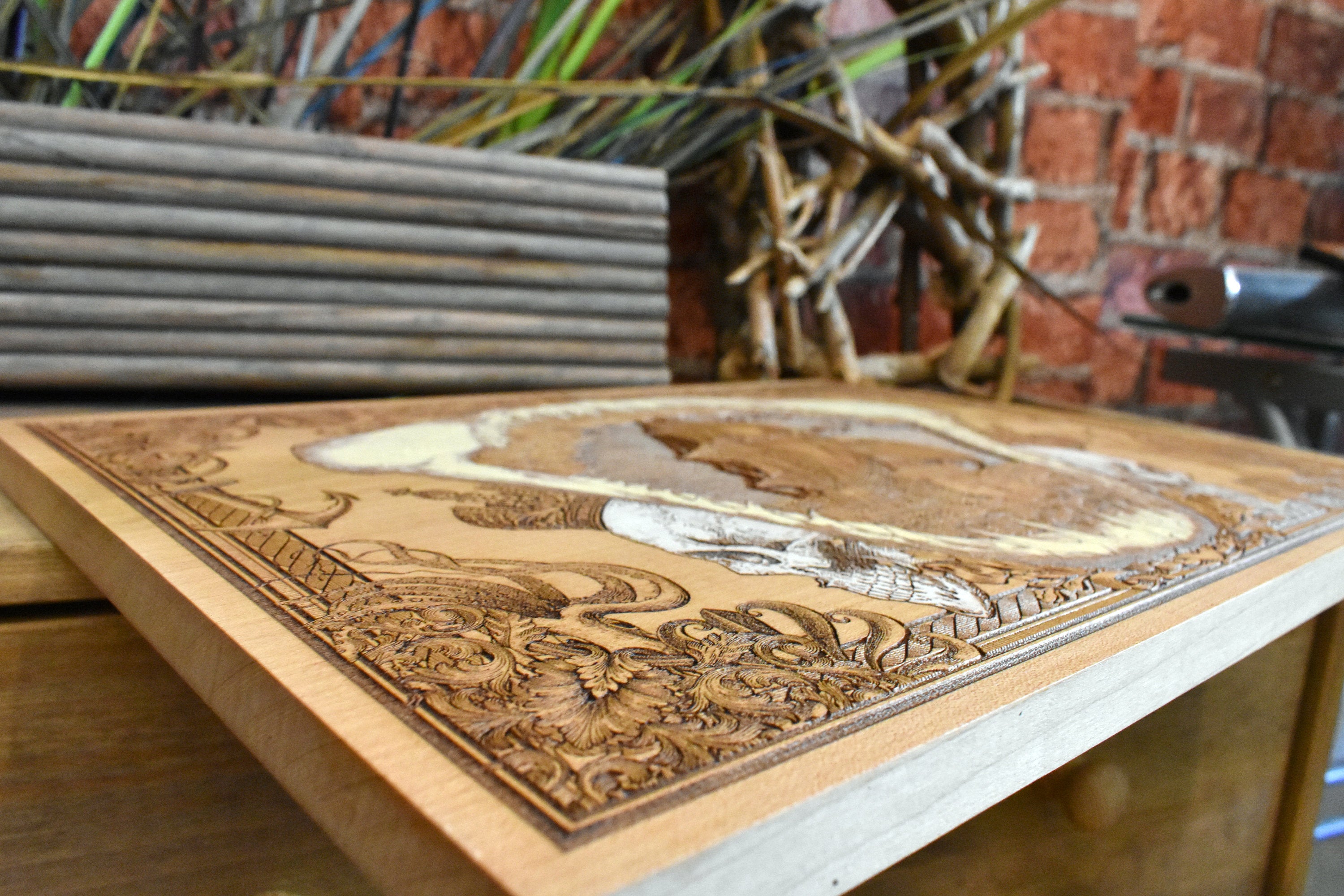 Handcrafted nautical shark jaw art with engraved pirate ship centerpiece.