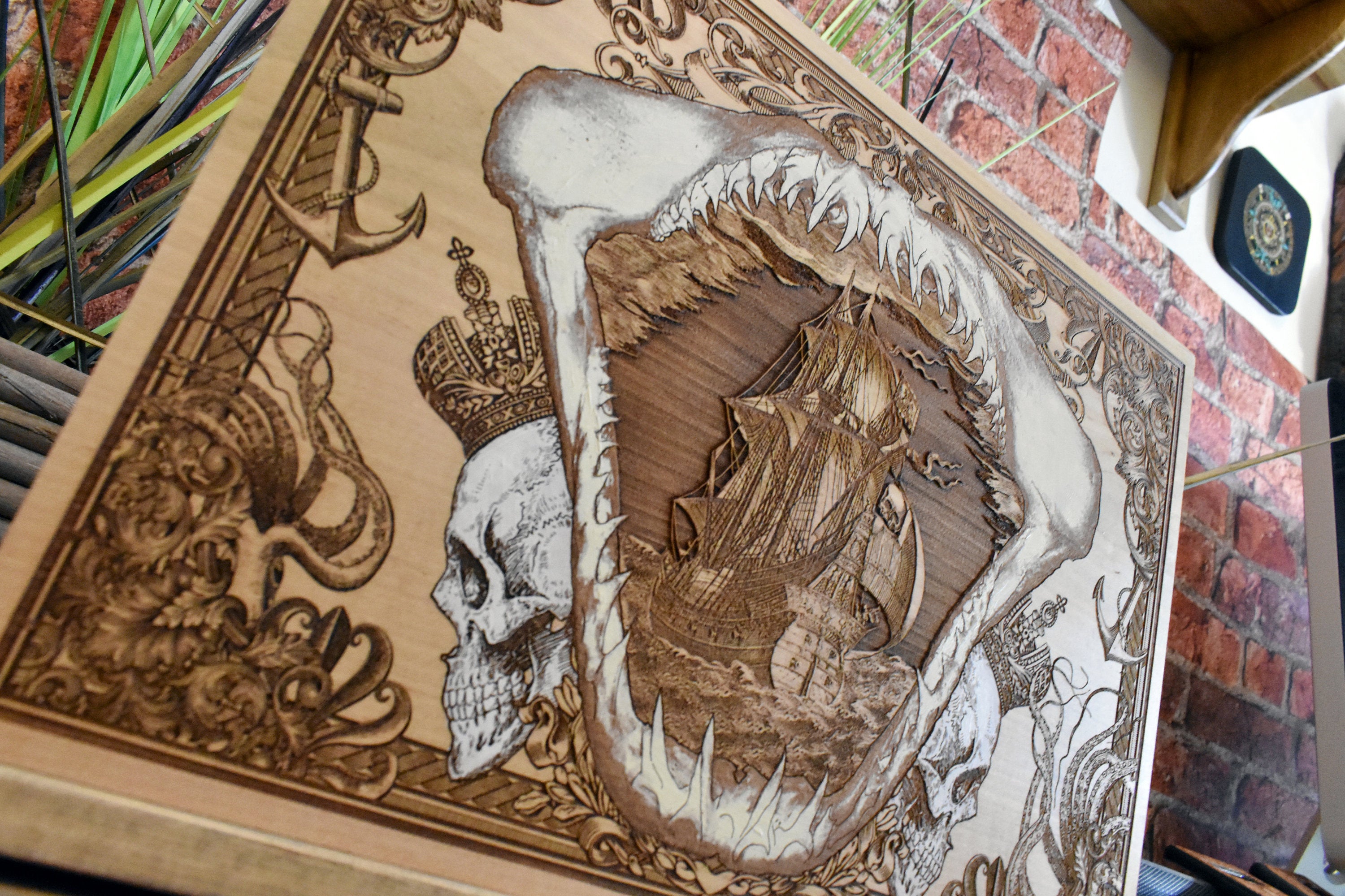 Limited edition maple wood artwork of shark mandible and sailing ship