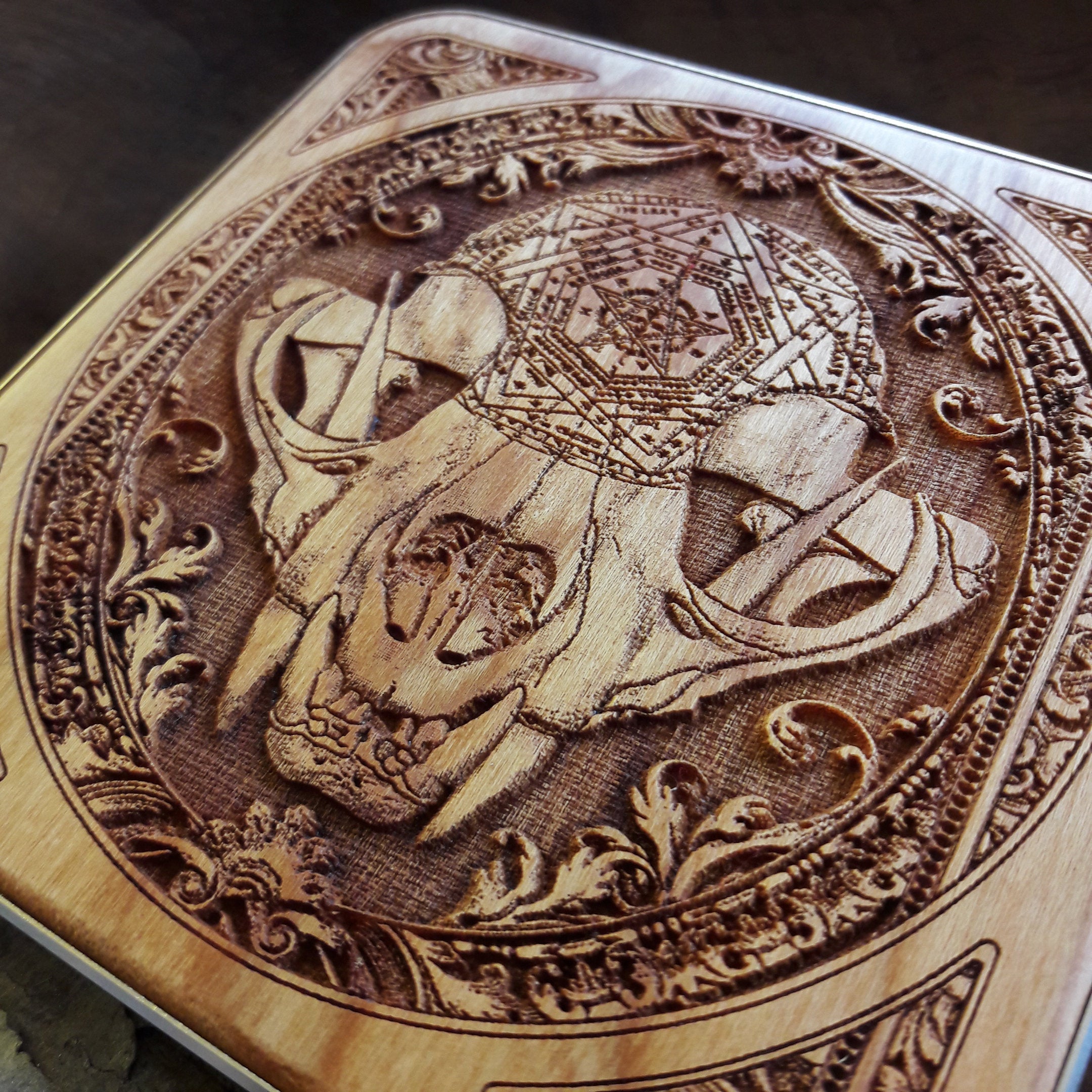 Wooden charging station with dark art engraving, styled in a gothic-inspired modern workspace.