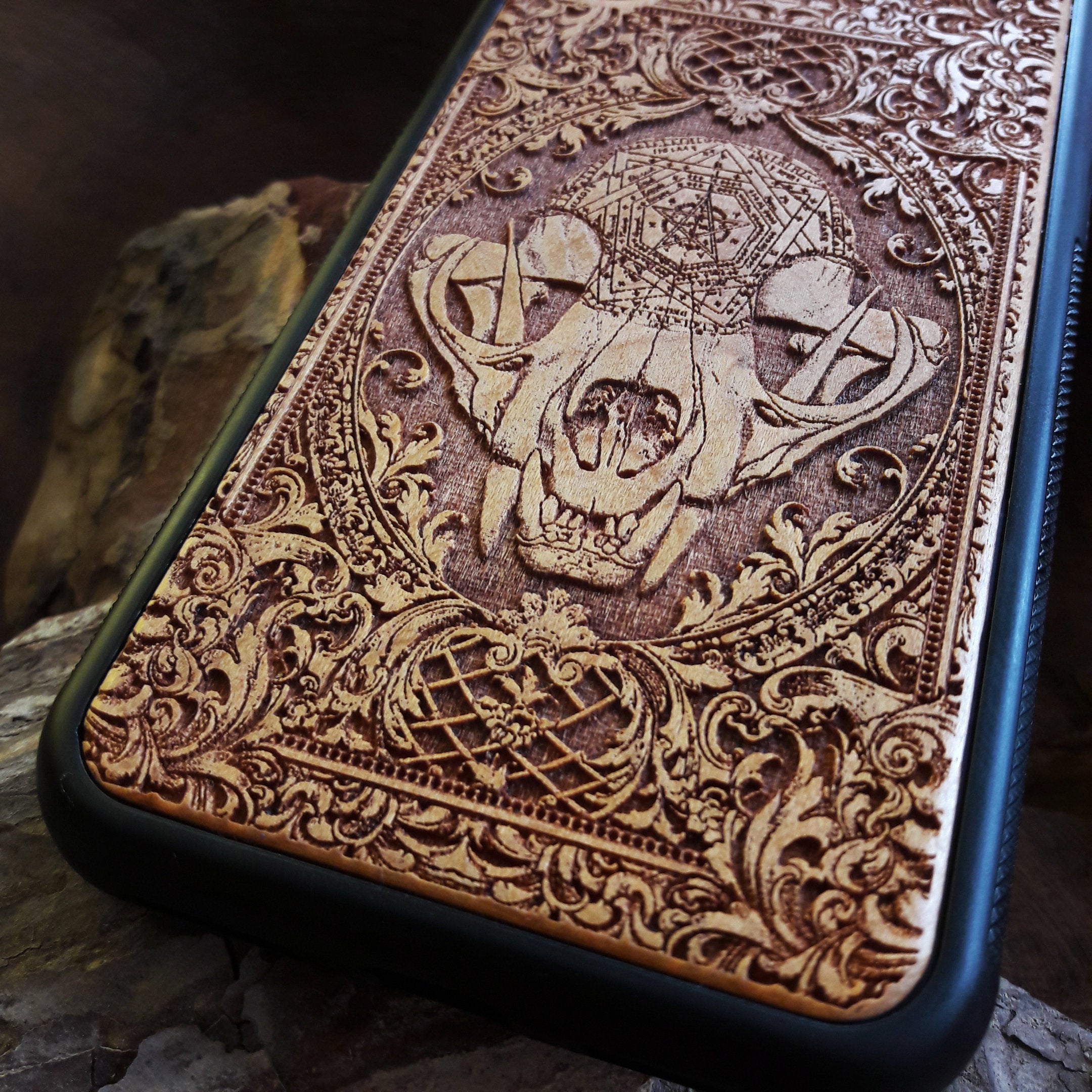 Wooden phone case with an evil cat skull design, intricately carved for iPhone , iPhone 15, Galaxy S, Note 20, and more. Perfect for fans of gothic and dark-themed accessories.