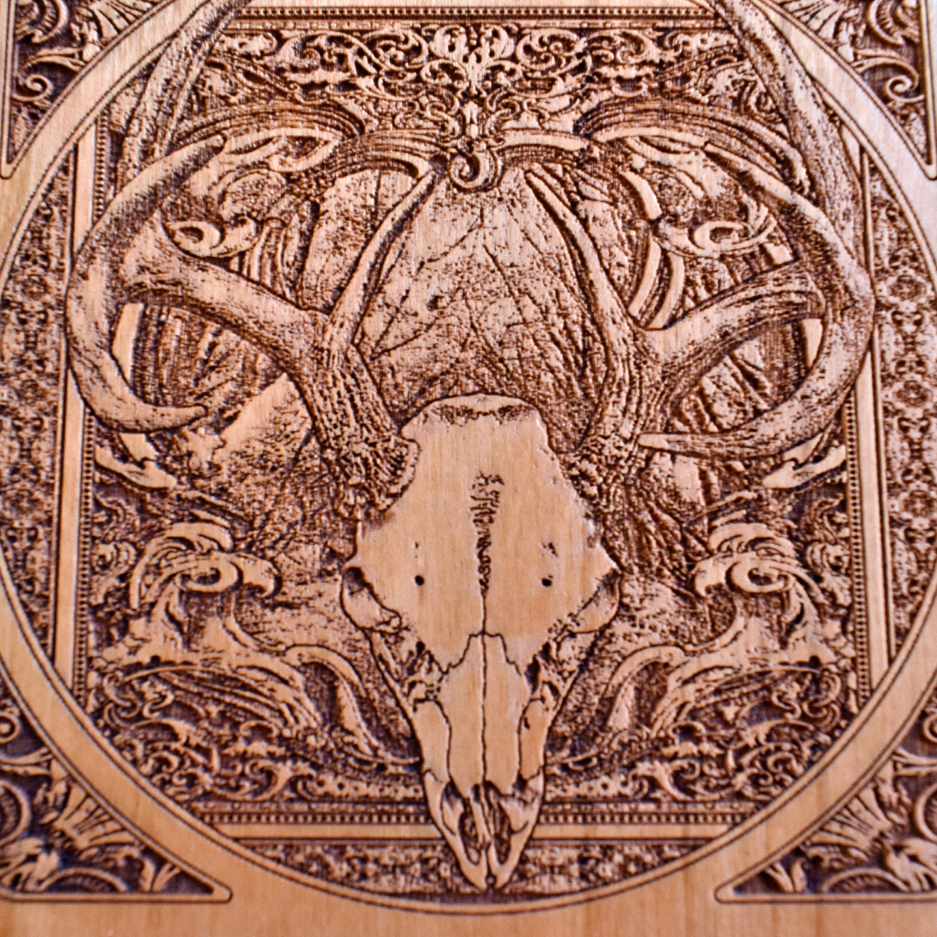 Eco-packaged wireless charger with deer skull engraving, ready as a unique handmade gift.