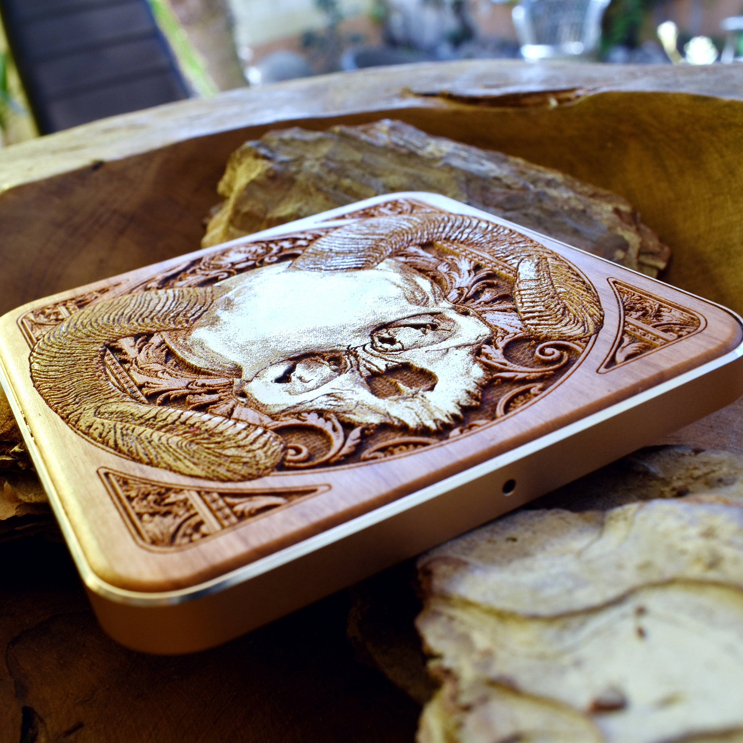 iPhone 16 on skull art wood wireless charger, fast charging with gothic dark art design, perfect for alternative style lovers.