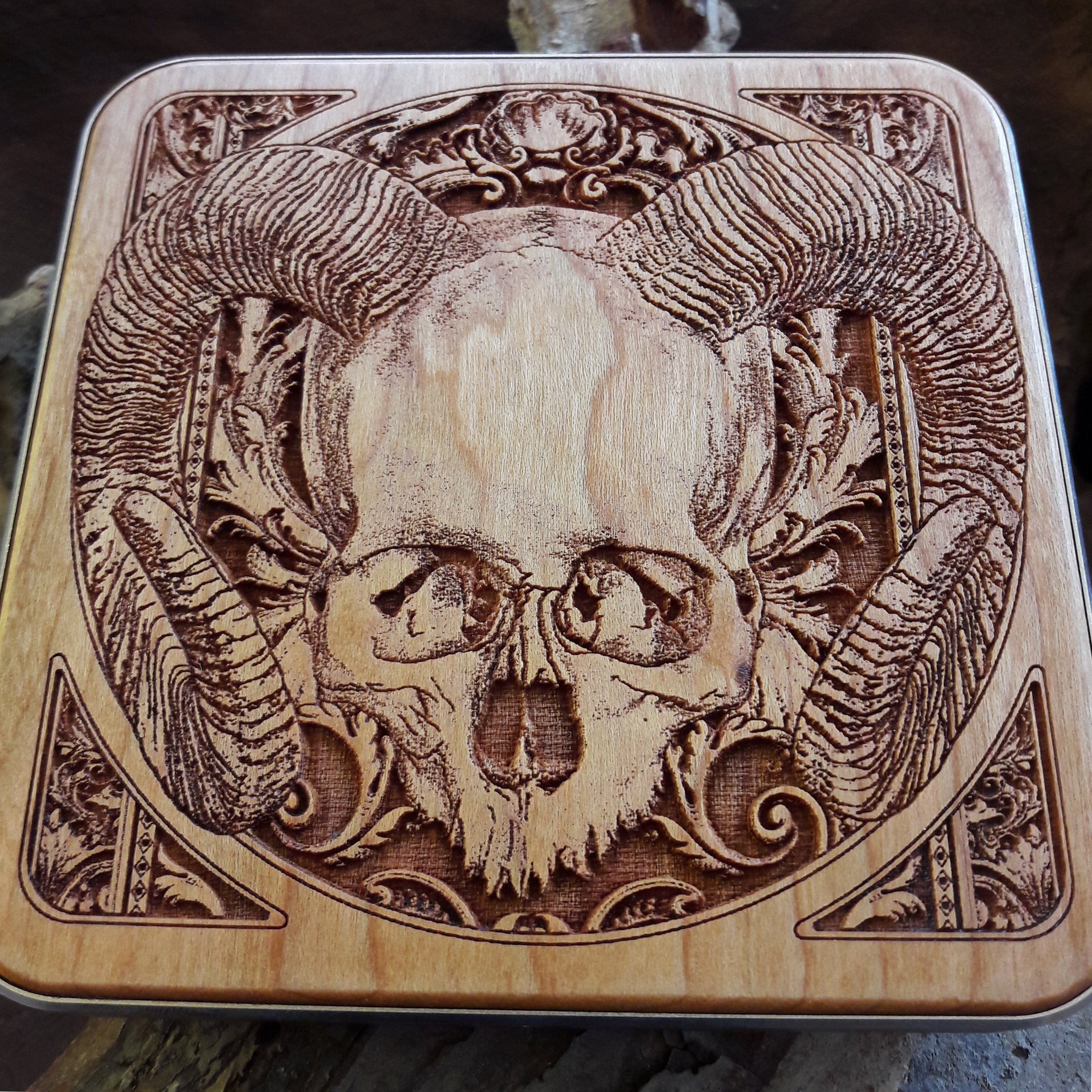 Detailed close-up of hand-painted human skull art on wireless charger, compatible with iPhone & Samsung, gothic home office accessory