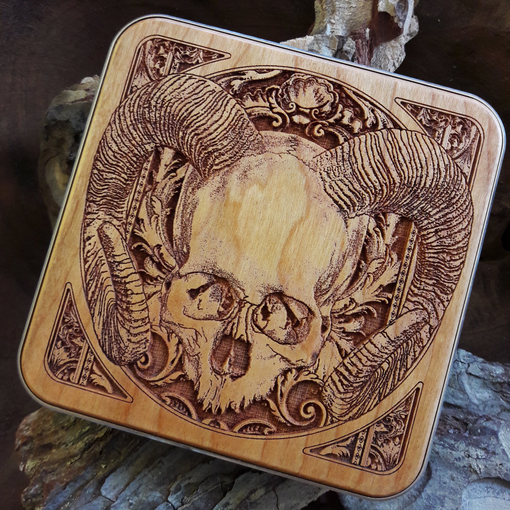 iPhone charging on human skull wireless charger, fast charging gothic desk pad with dark art for horror fans