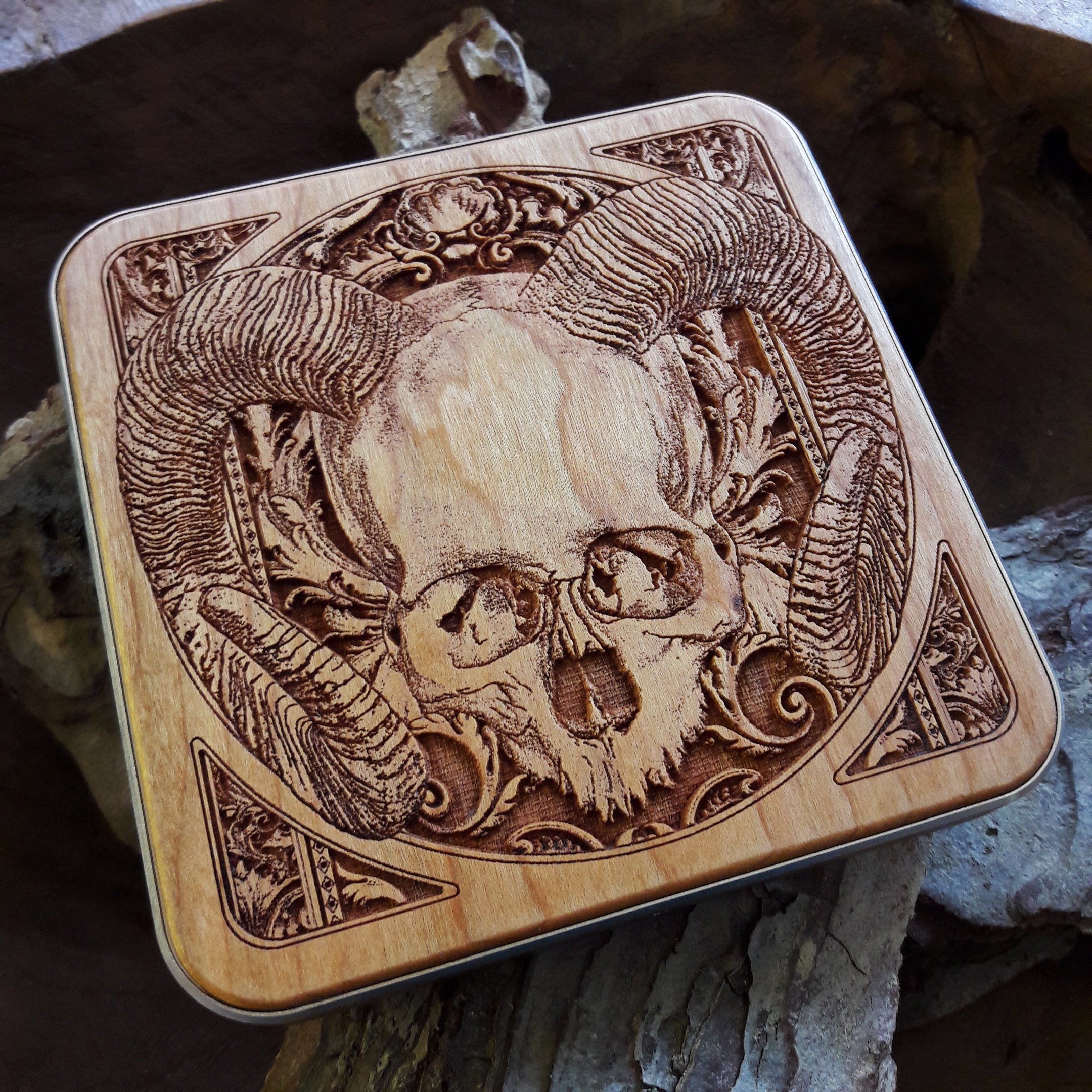 Human skull wireless charger on gothic desk setup, fast charging pad for iPhone & Samsung with dark art décor style