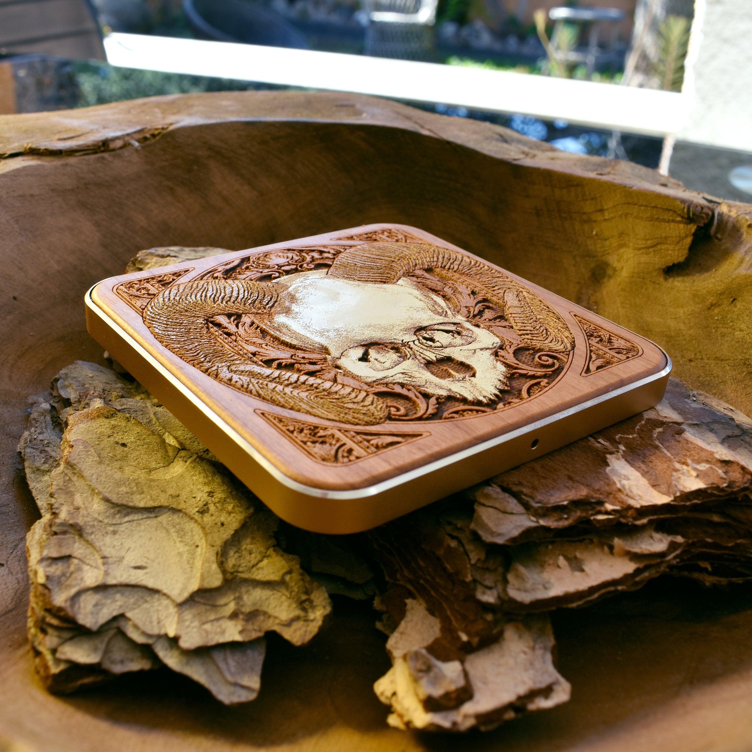 Handcrafted wireless charging pad with unique skull art, fast charging for Galaxy S25 and iPhone 16, gothic home office accessory.
