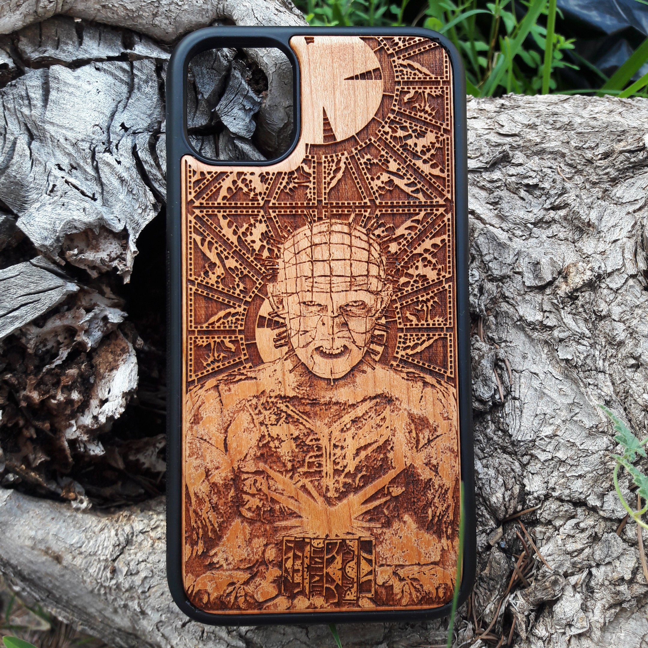 Pinhead-inspired wood phone case for iPhone , 15, 14, 13, 12, 11 Pro Max, Mini & Samsung Galaxy S, S24, S23, S22, S21, S20 Ultra Plus, Note 20 with intricate laser engraving design from Hellraiser. Durable, sleek, and unique, perfect for horror movie fans.