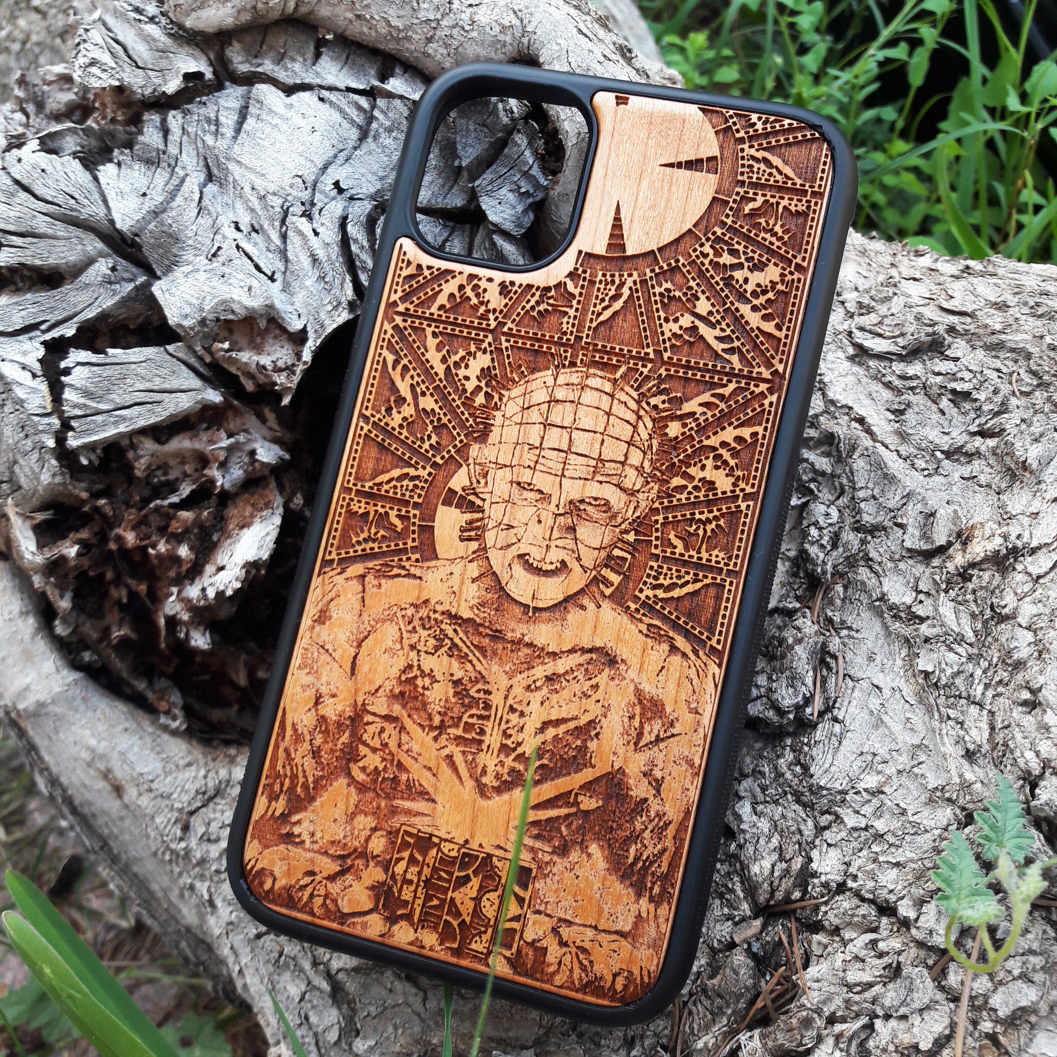 Pinhead-inspired wood phone case for iPhone , 15, 14, 13, 12, 11 Pro Max, Mini & Samsung Galaxy S, S24, S23, S22, S21, S20 Ultra Plus, Note 20 with intricate laser engraving design from Hellraiser. Durable, sleek, and unique, perfect for horror movie fans.