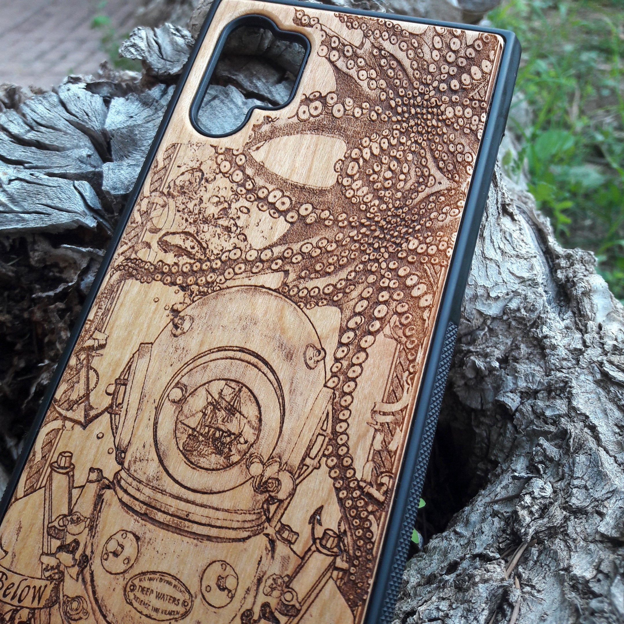 Wooden phone case featuring a detailed deep-sea diver and kraken design, laser-engraved for iPhone , iPhone 15, Samsung Galaxy S, and other models. A must-have for fans of nautical and mythical art.