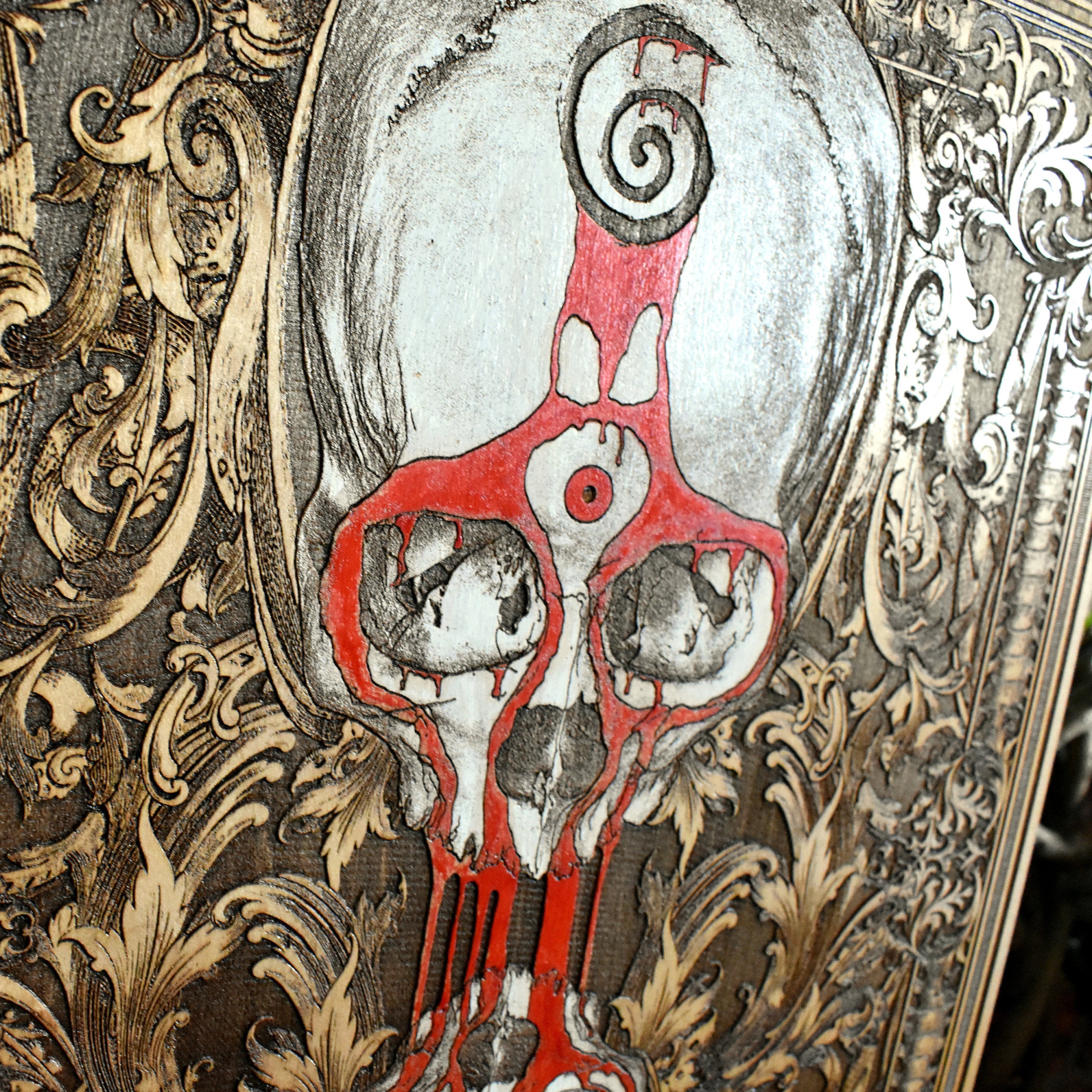 Laser-engraved skull and clock art on maple wood for dark home decor.