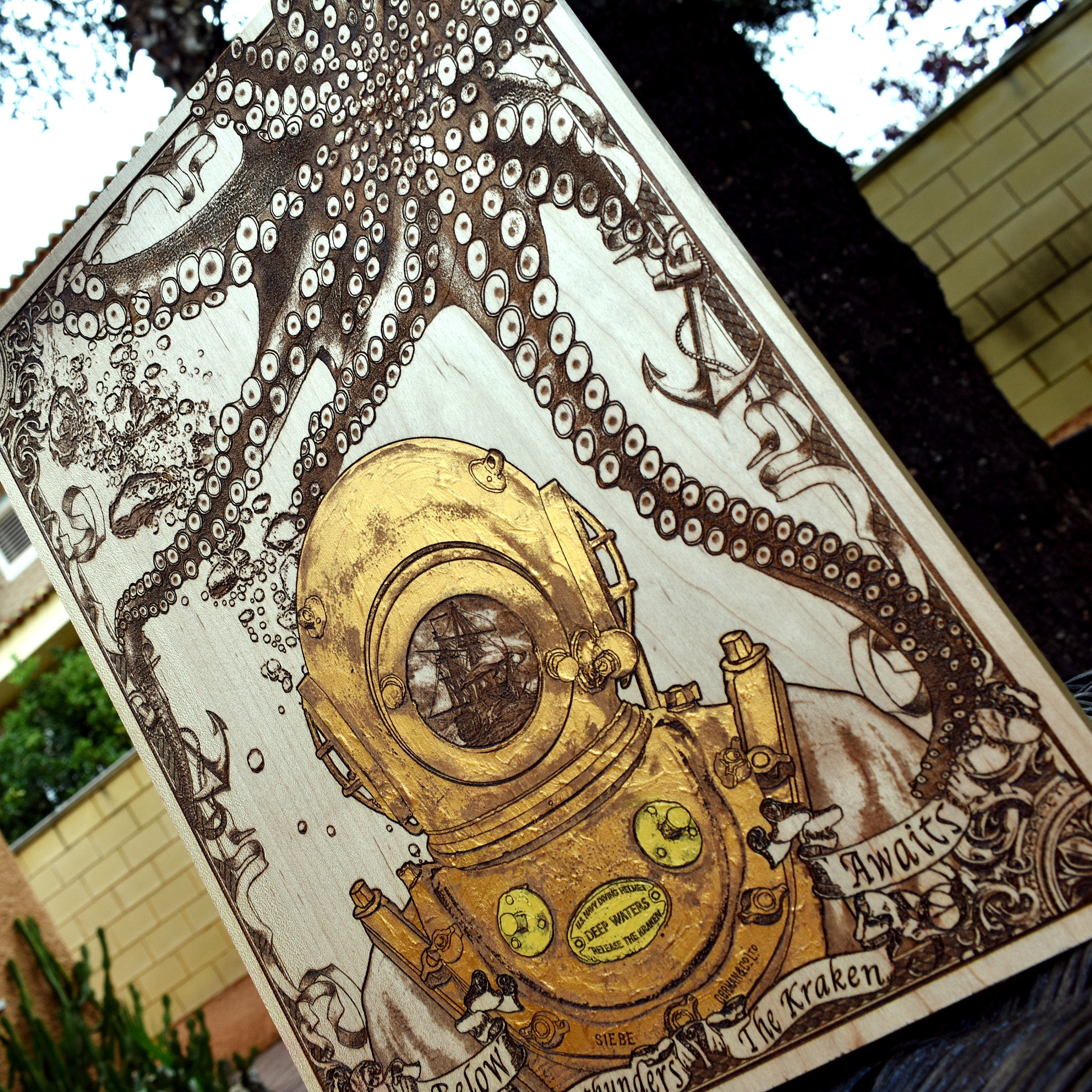 Rustic wooden wall decor featuring kraken and vintage dive helmet