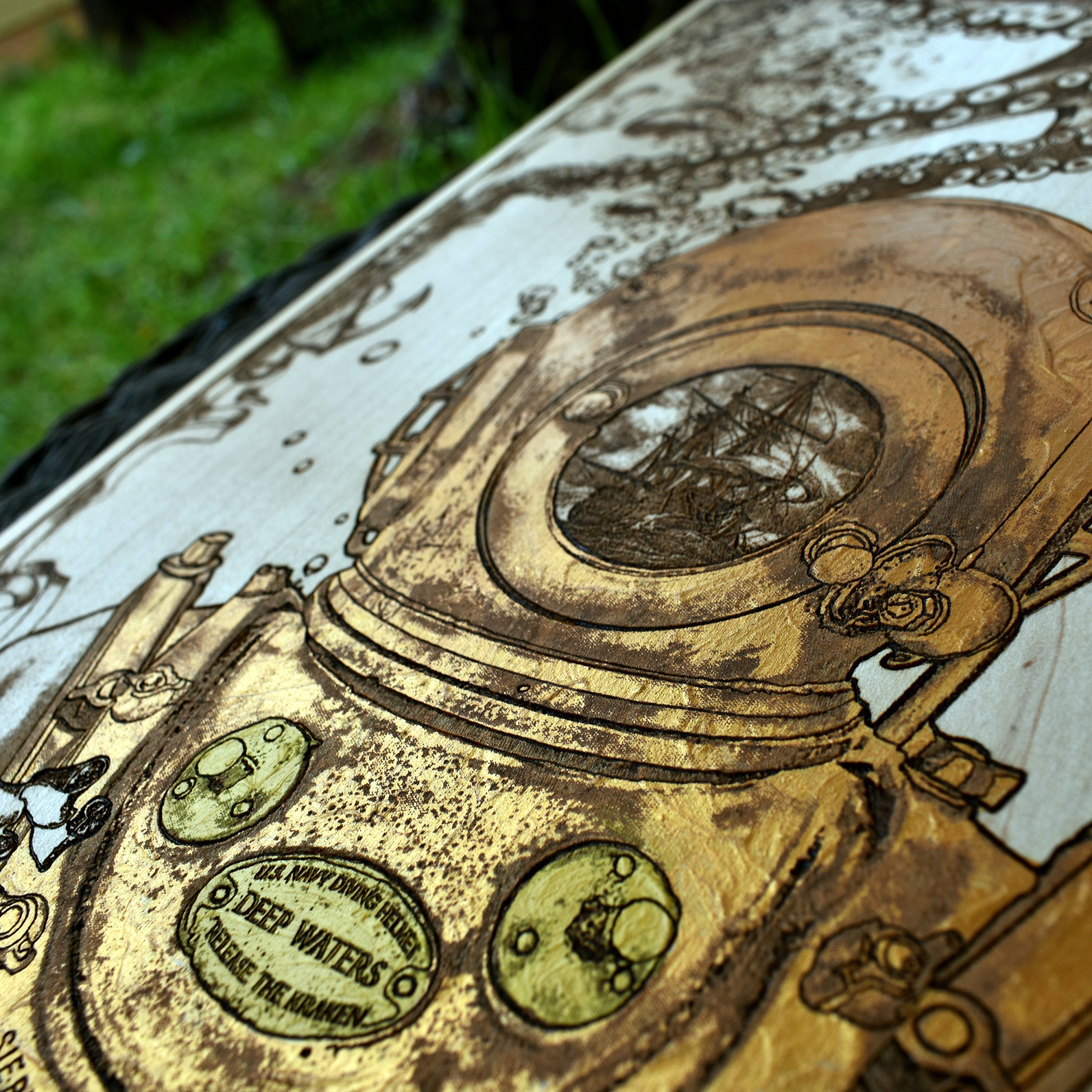 Ocean-themed wall hanging with engraved kraken diver helmet design