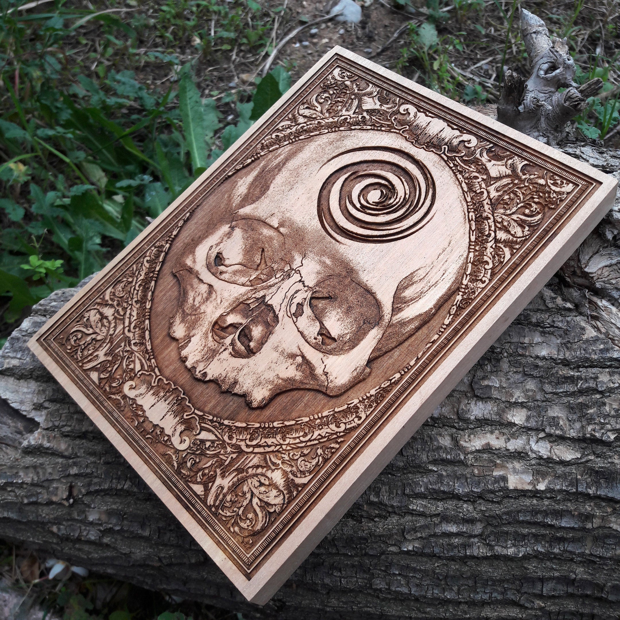 Handcrafted gothic skull artwork on wood, perfect for dark home decor and alternative wall art