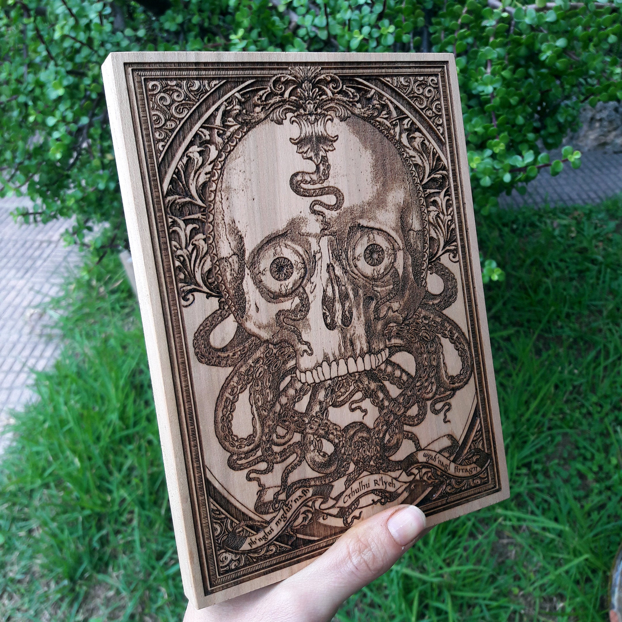 Macabre skull & tentacles artwork, gothic Lovecraftian horror wood decor for dark-themed homes.