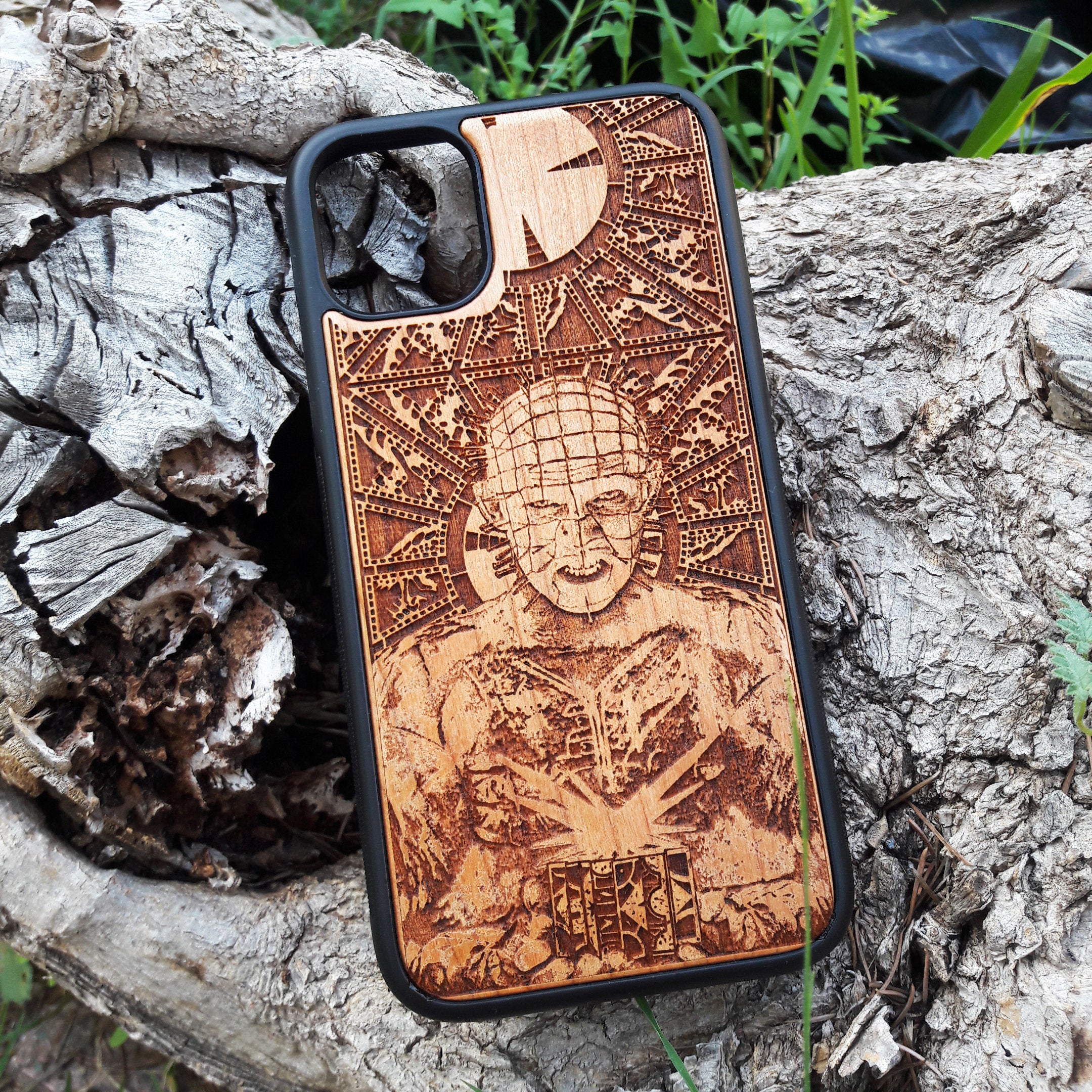 Pinhead-inspired wood phone case for iPhone , 15, 14, 13, 12, 11 Pro Max, Mini & Samsung Galaxy S, S24, S23, S22, S21, S20 Ultra Plus, Note 20 with intricate laser engraving design from Hellraiser. Durable, sleek, and unique, perfect for horror movie fans.