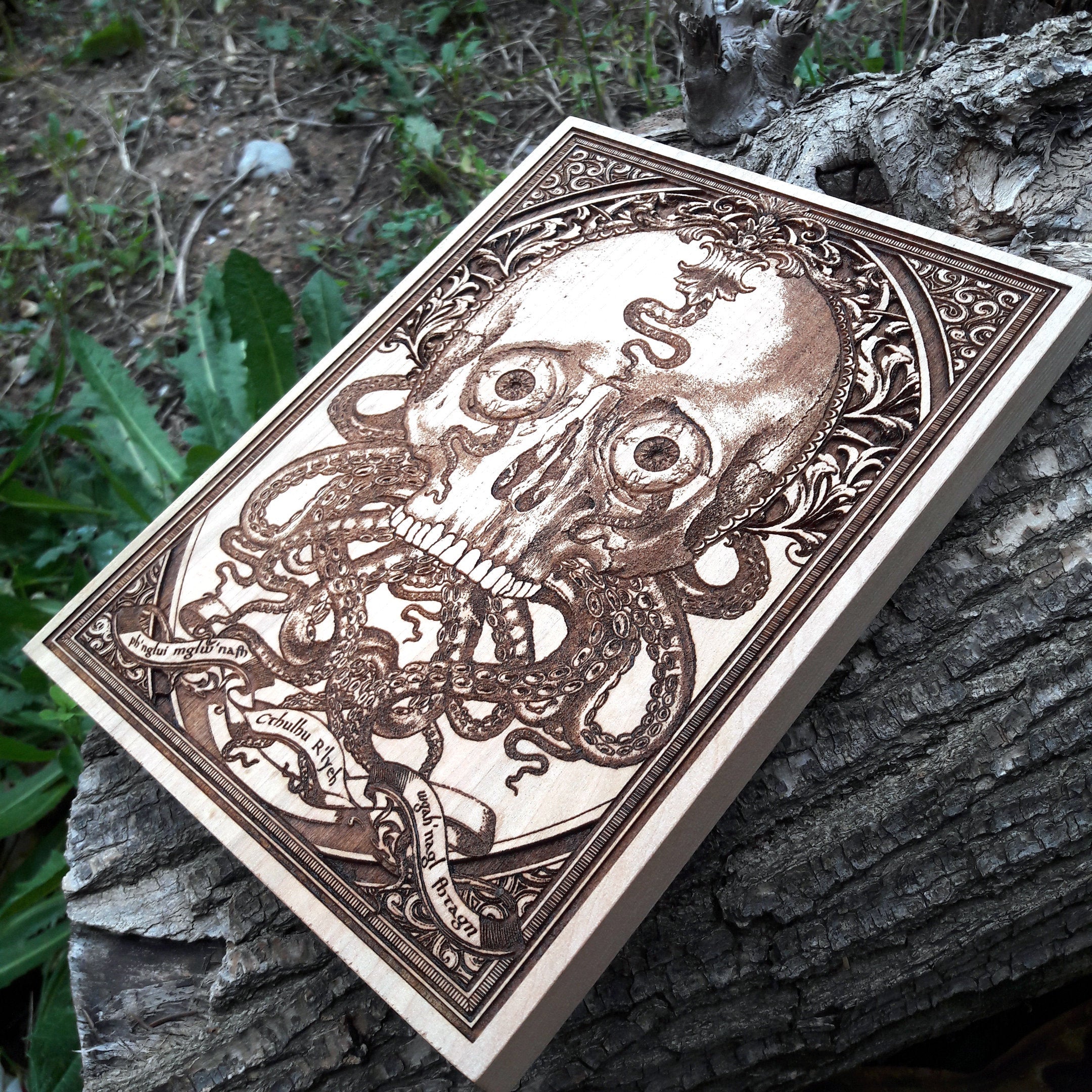 Detailed laser-engraved Cthulhu skull art on wood, gothic fantasy decor for horror collectors.