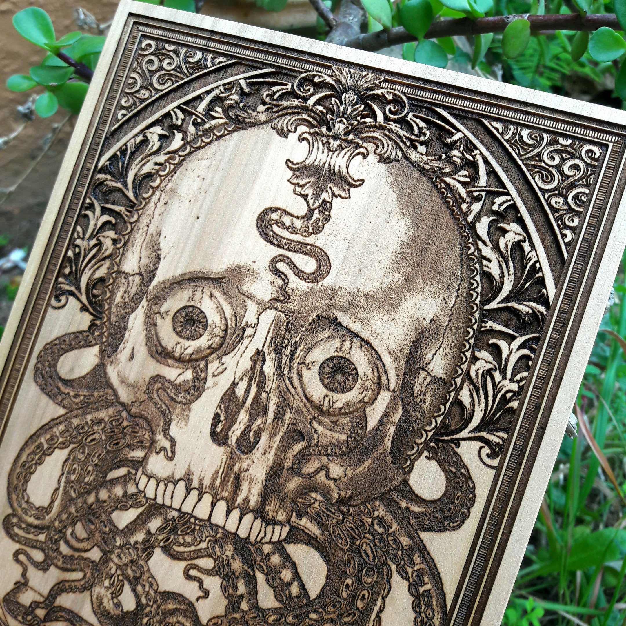 Eerie Cthulhu-inspired wooden skull artwork, dark horror wall art with intricate tentacles.