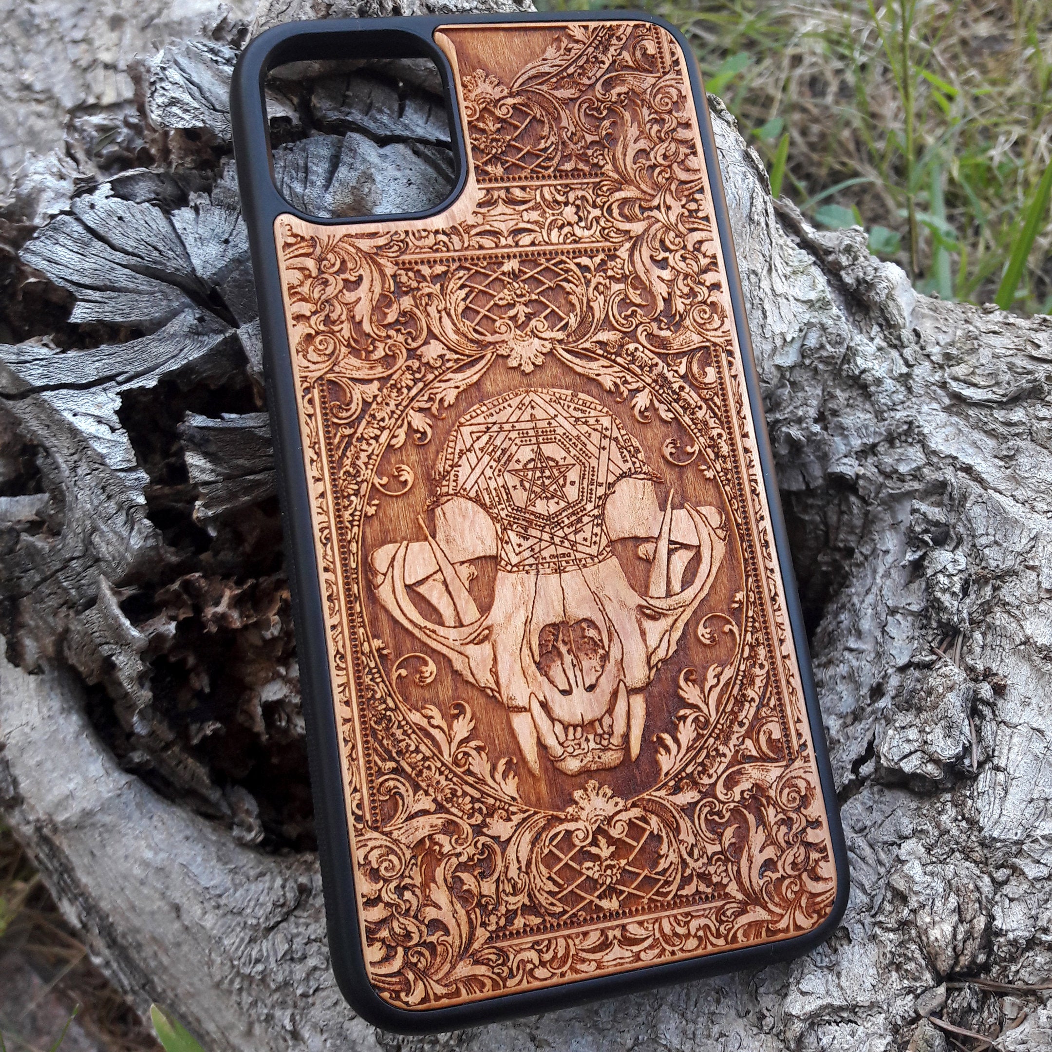 Wooden phone case with an evil cat skull design, intricately carved for iPhone , iPhone 15, Galaxy S, Note 20, and more. Perfect for fans of gothic and dark-themed accessories.