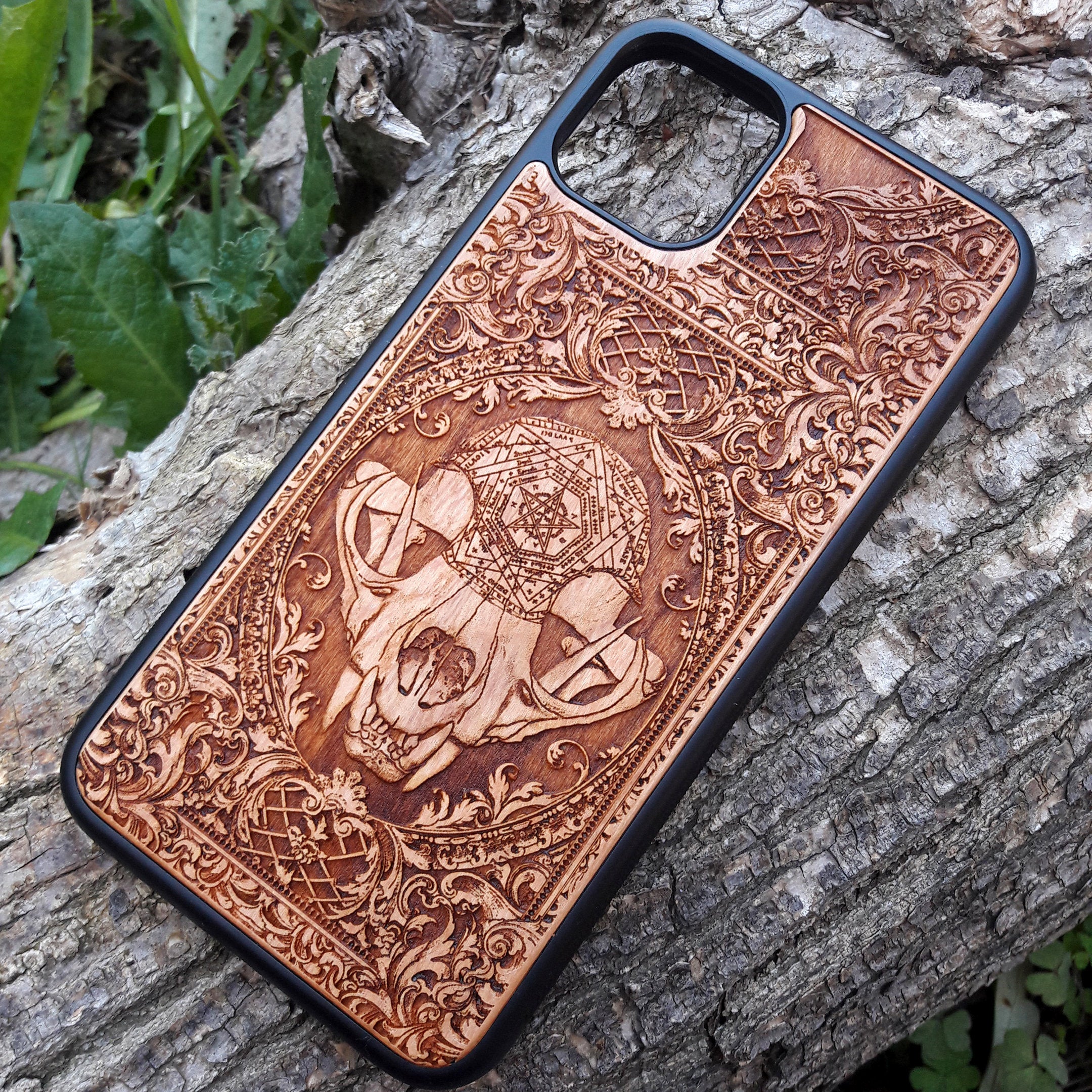 Wooden phone case with an evil cat skull design, intricately carved for iPhone , iPhone 15, Galaxy S, Note 20, and more. Perfect for fans of gothic and dark-themed accessories.