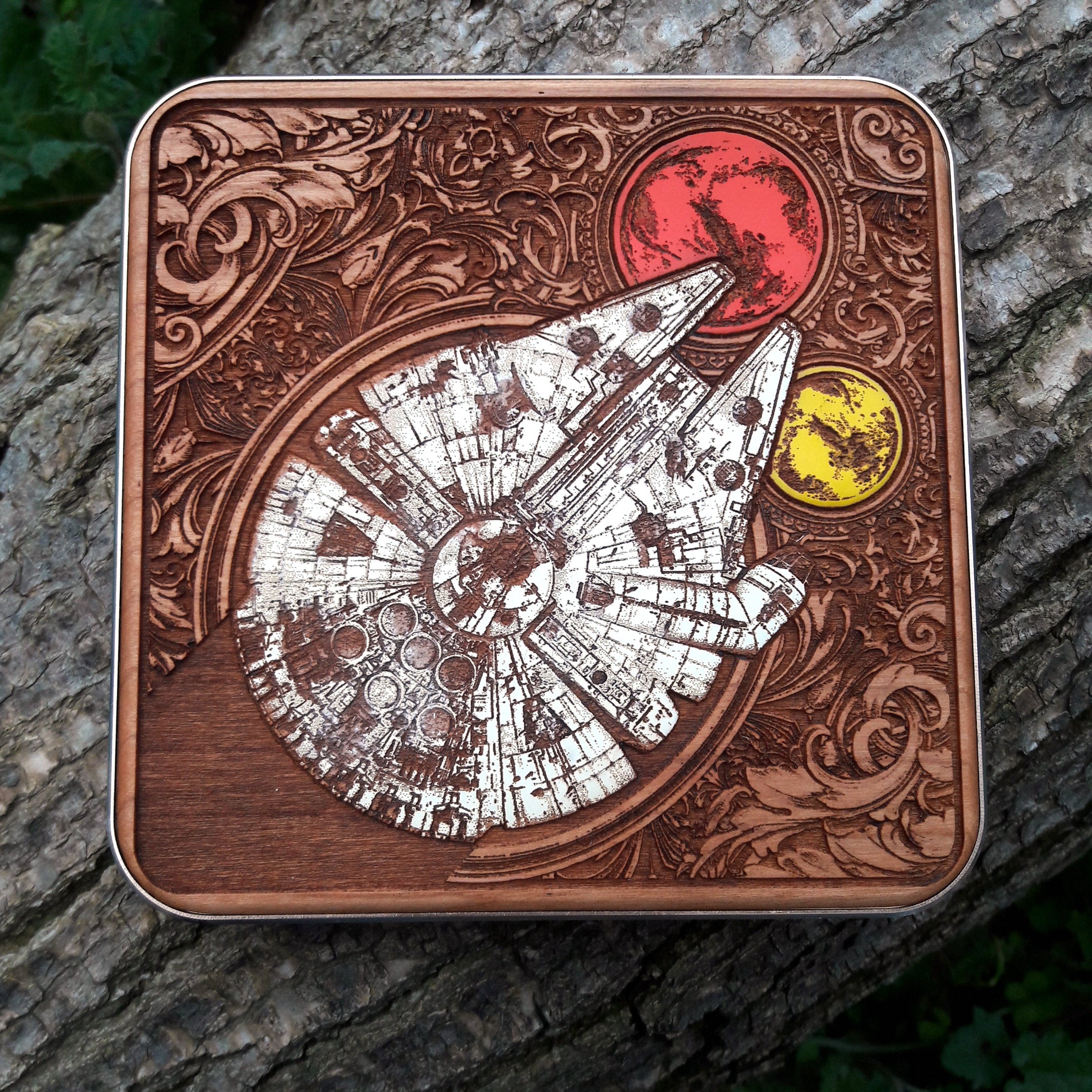 Side view of dark wood wireless charger with starfighter designs.