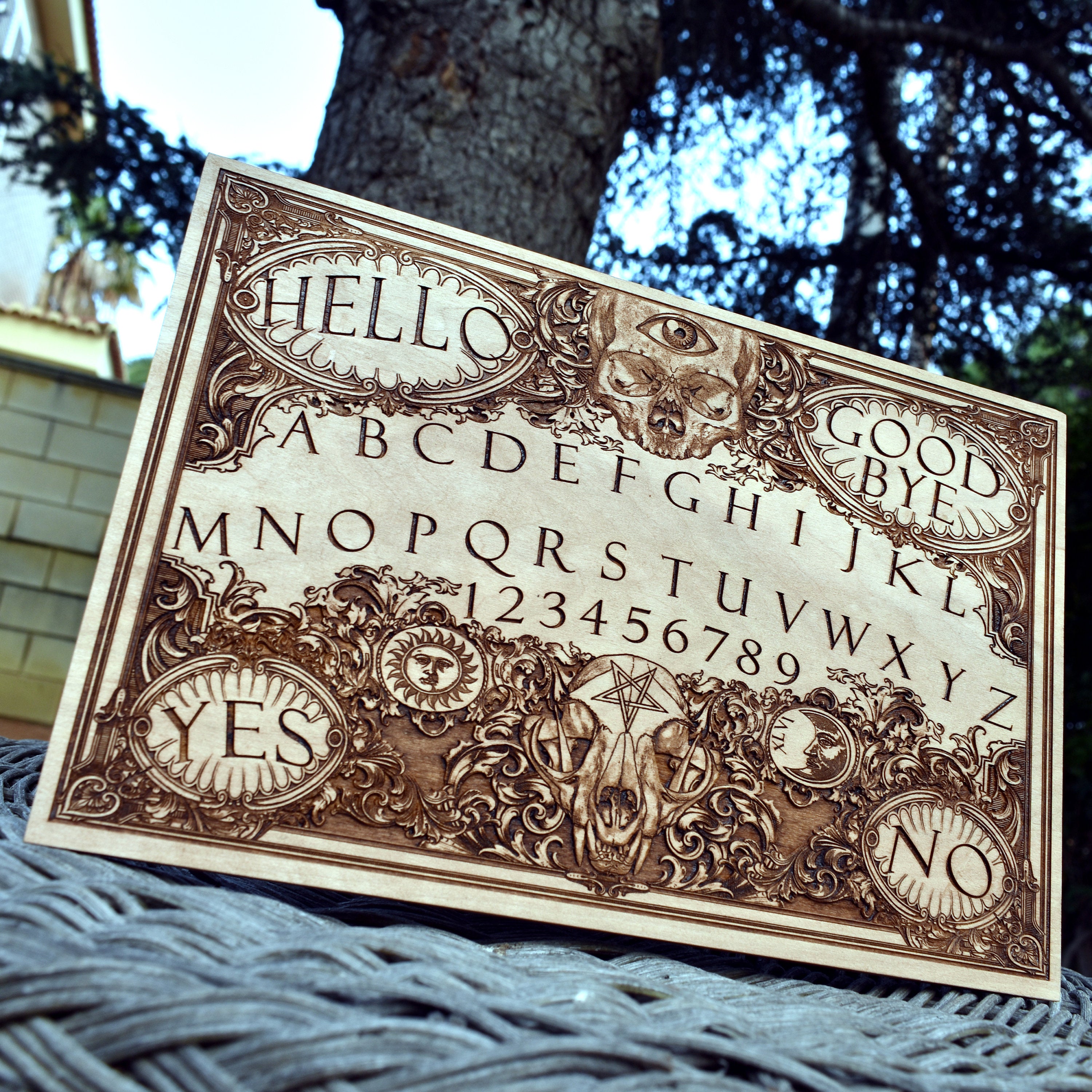 Unique spirit board with mystical engravings on solid wood.