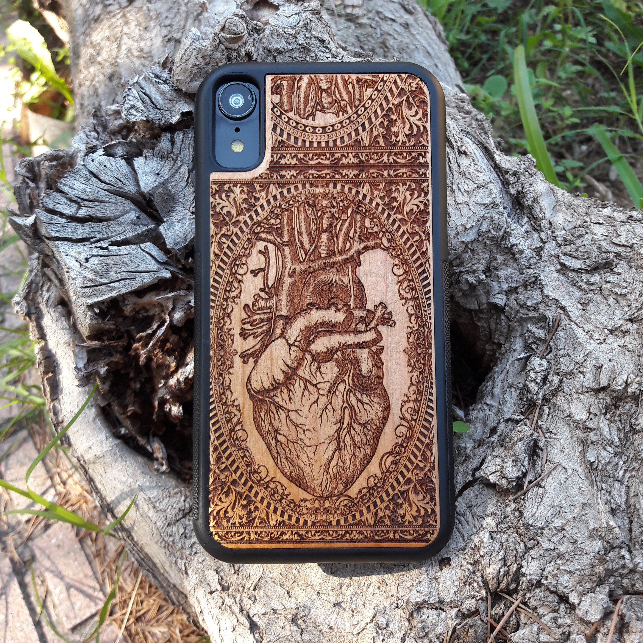 Wooden phone case with an anatomical human heart design, laser-engraved for iPhone , Samsung Galaxy S, and more. Perfect for fans of medical art, anatomy, and unique phone accessories.