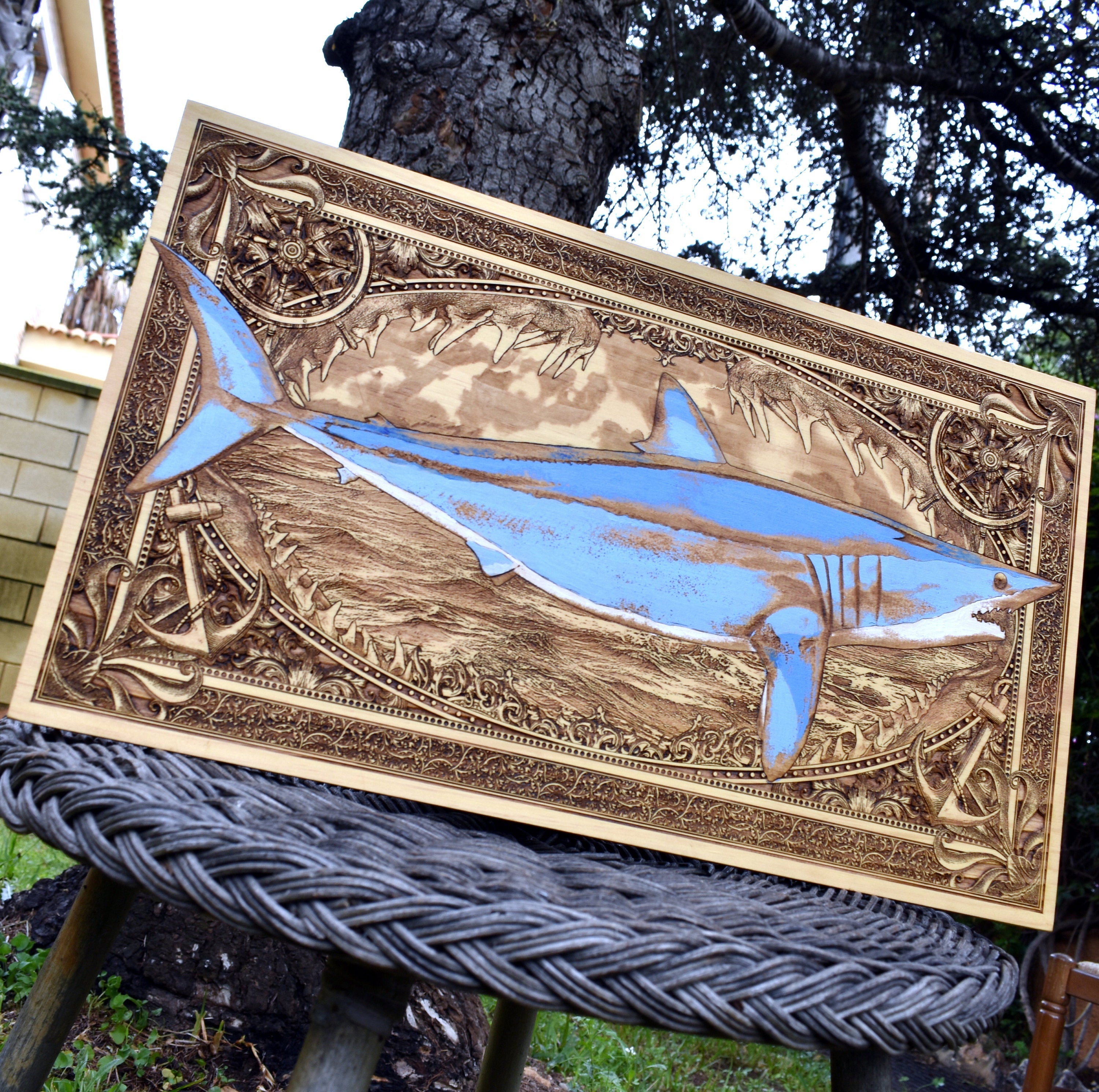 Extra-large blue mako shark wood wall art, angled outdoor view highlighting the blue shark
