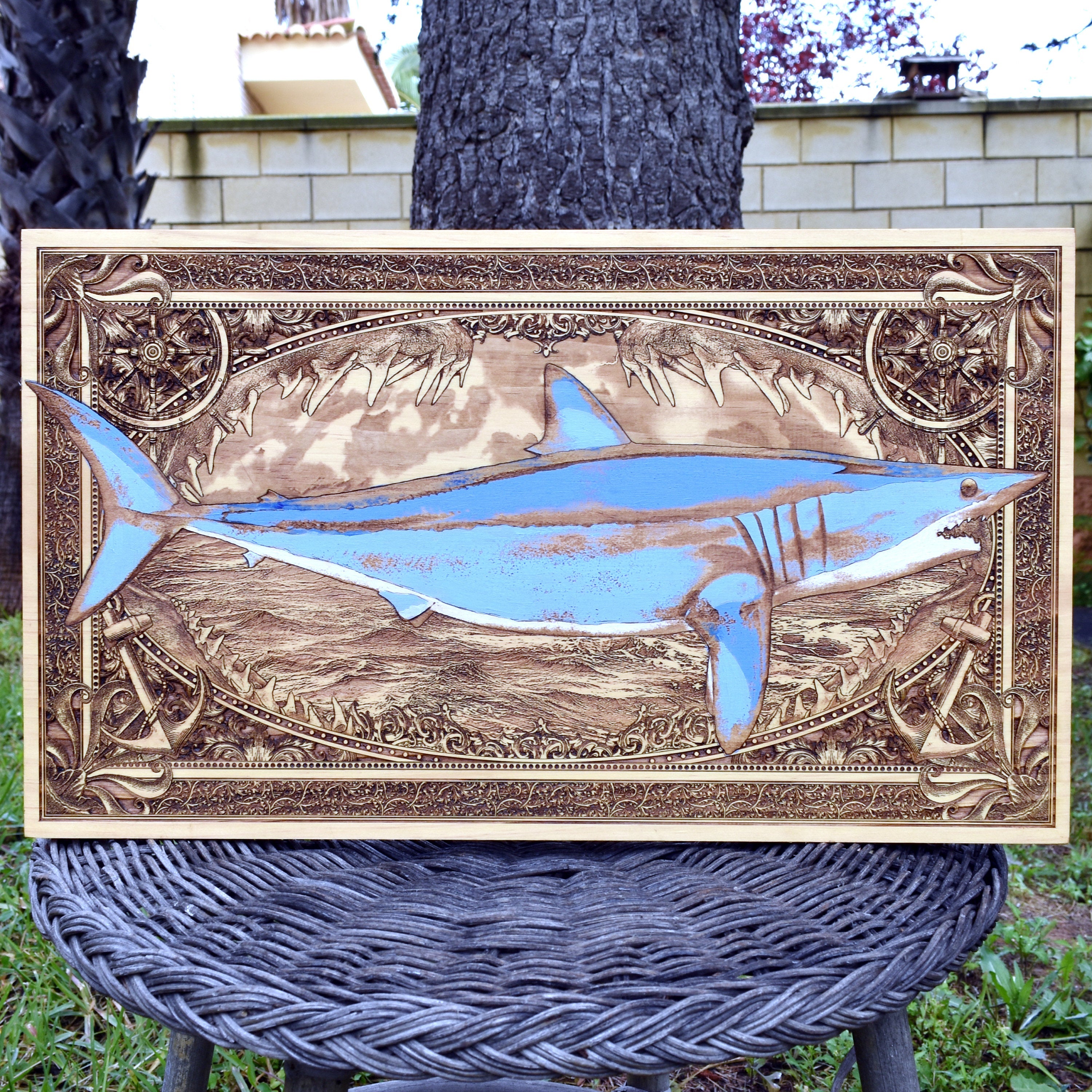 Extra-large blue mako shark wood wall art, full front view of the hand-painted shark over an ocean scene