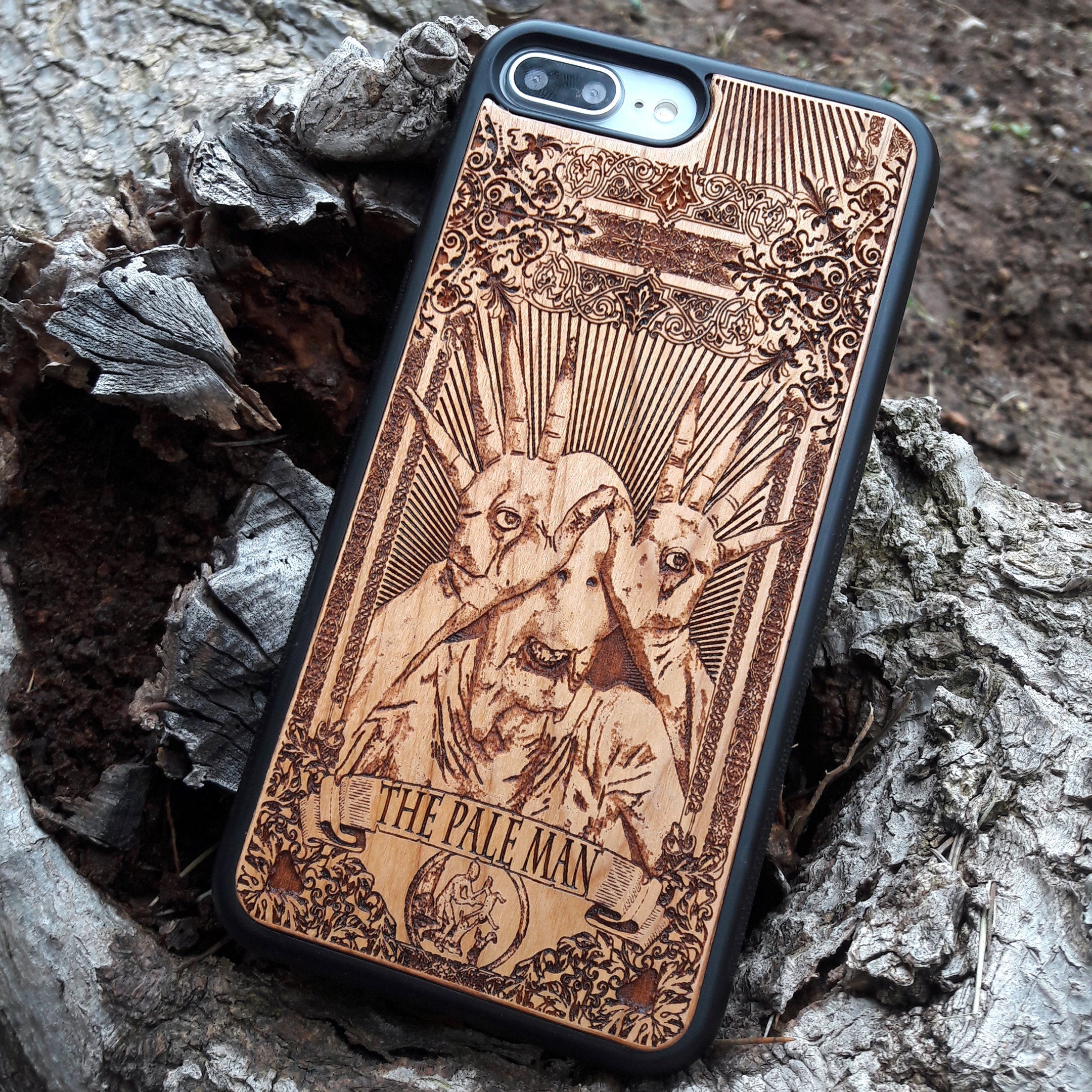 Wooden phone case with Pale Man design from Pan's Labyrinth, intricately engraved for iPhone , Galaxy S, and more. Gothic horror design offering premium protection.