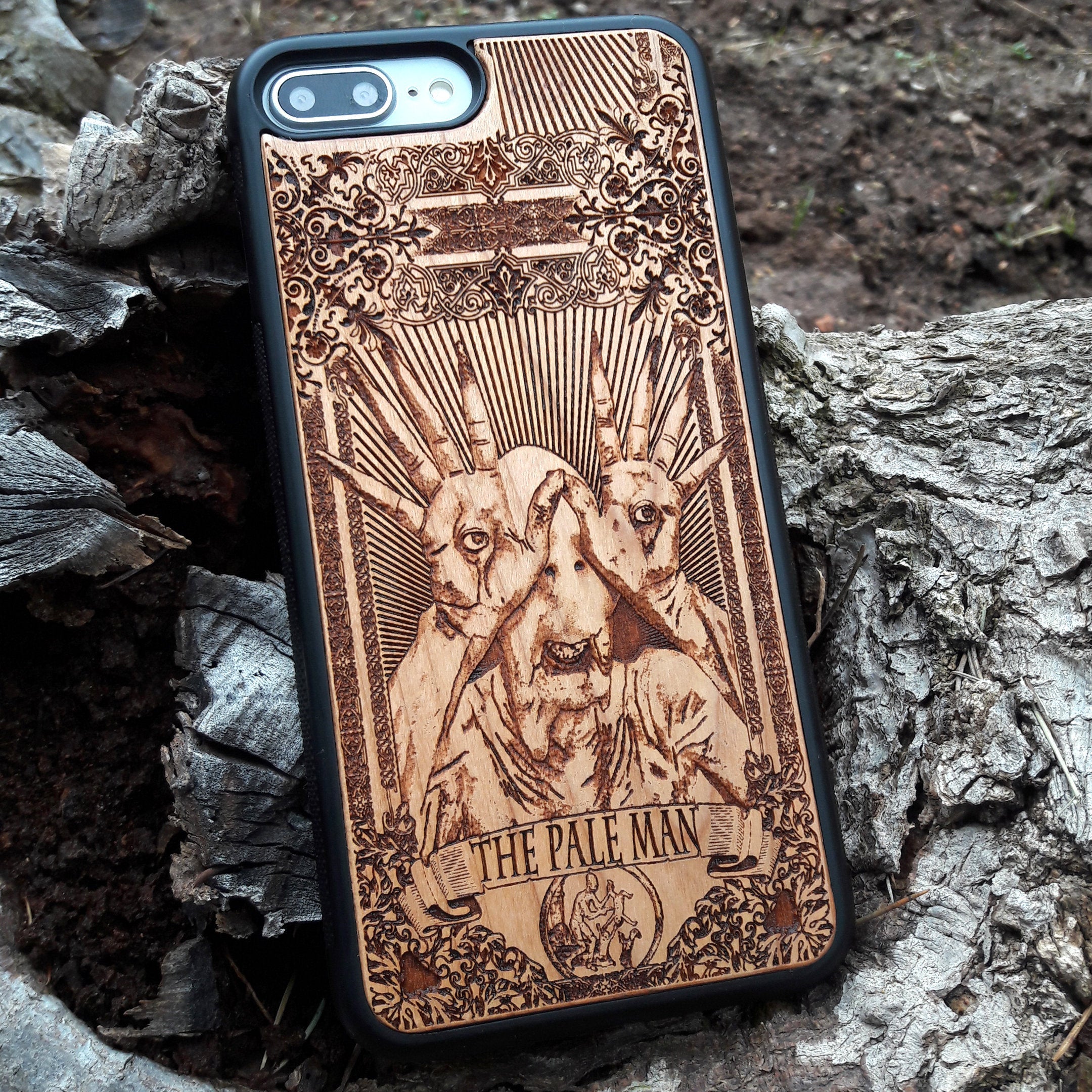 Wooden phone case with Pale Man design from Pan's Labyrinth, intricately engraved for iPhone , Galaxy S, and more. Gothic horror design offering premium protection.
