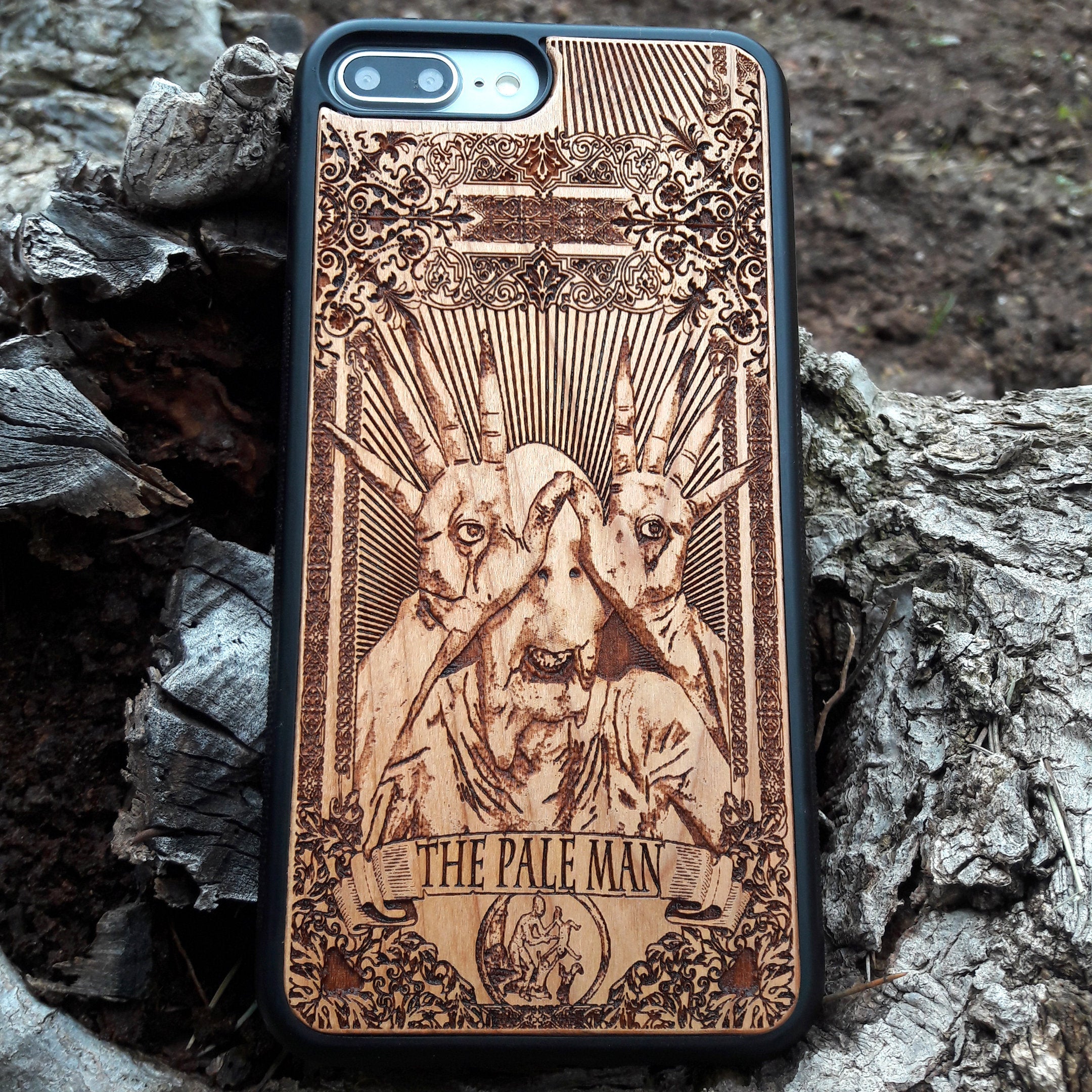 Wooden phone case with Pale Man design from Pan's Labyrinth, intricately engraved for iPhone , Galaxy S, and more. Gothic horror design offering premium protection.