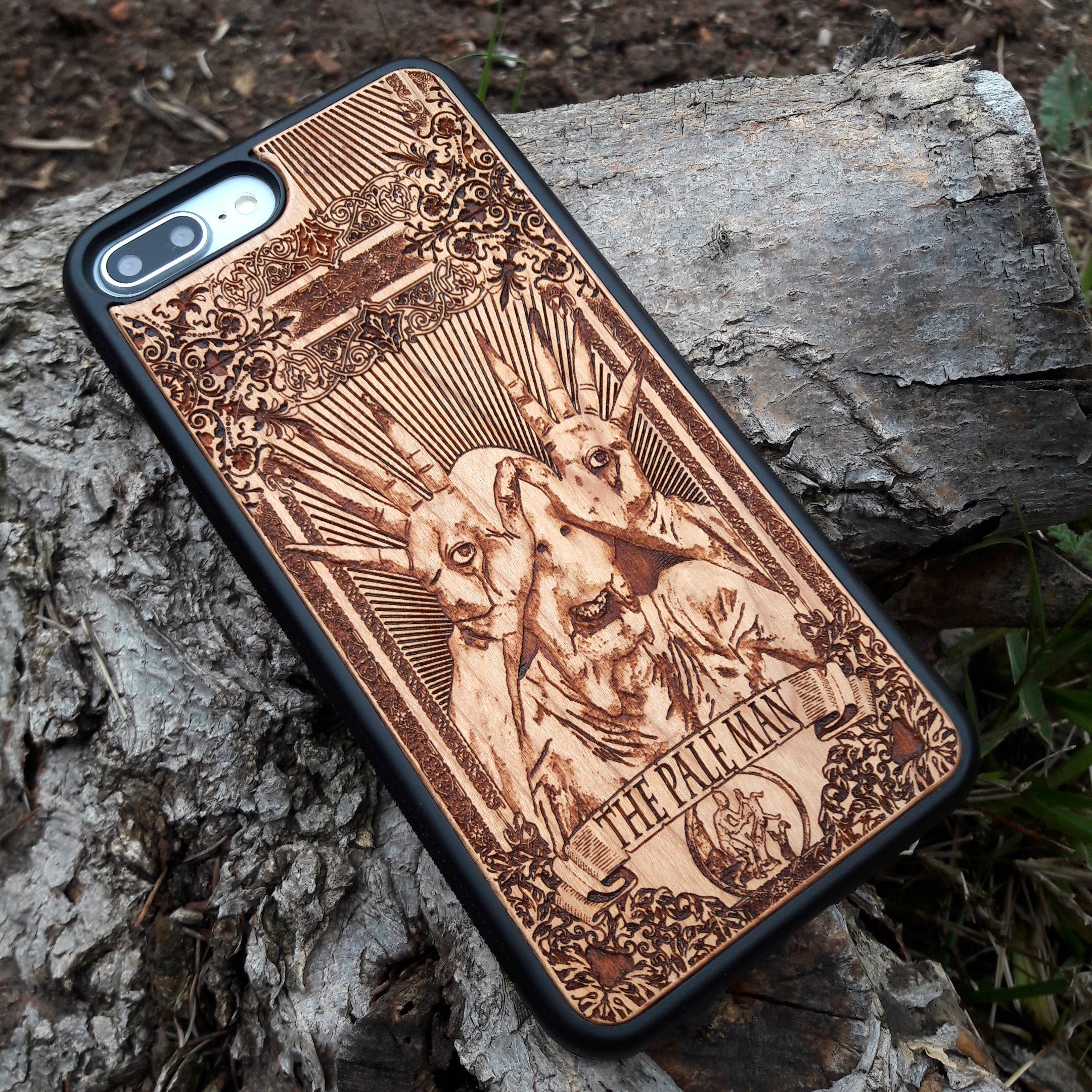 Wooden phone case with Pale Man design from Pan's Labyrinth, intricately engraved for iPhone , Galaxy S, and more. Gothic horror design offering premium protection.