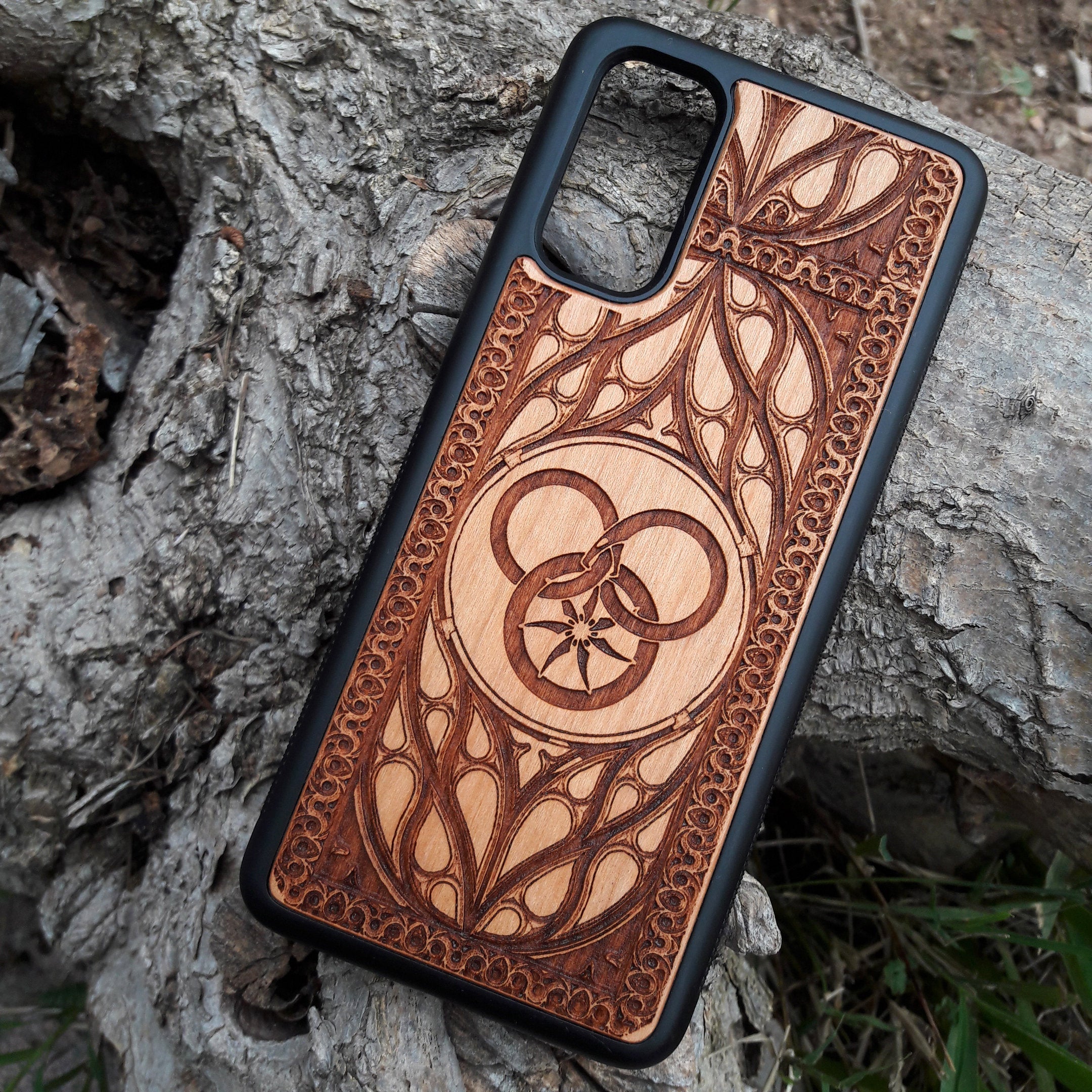 Handcrafted wood phone case featuring Wheel of Time symbol for iPhone & Galaxy
