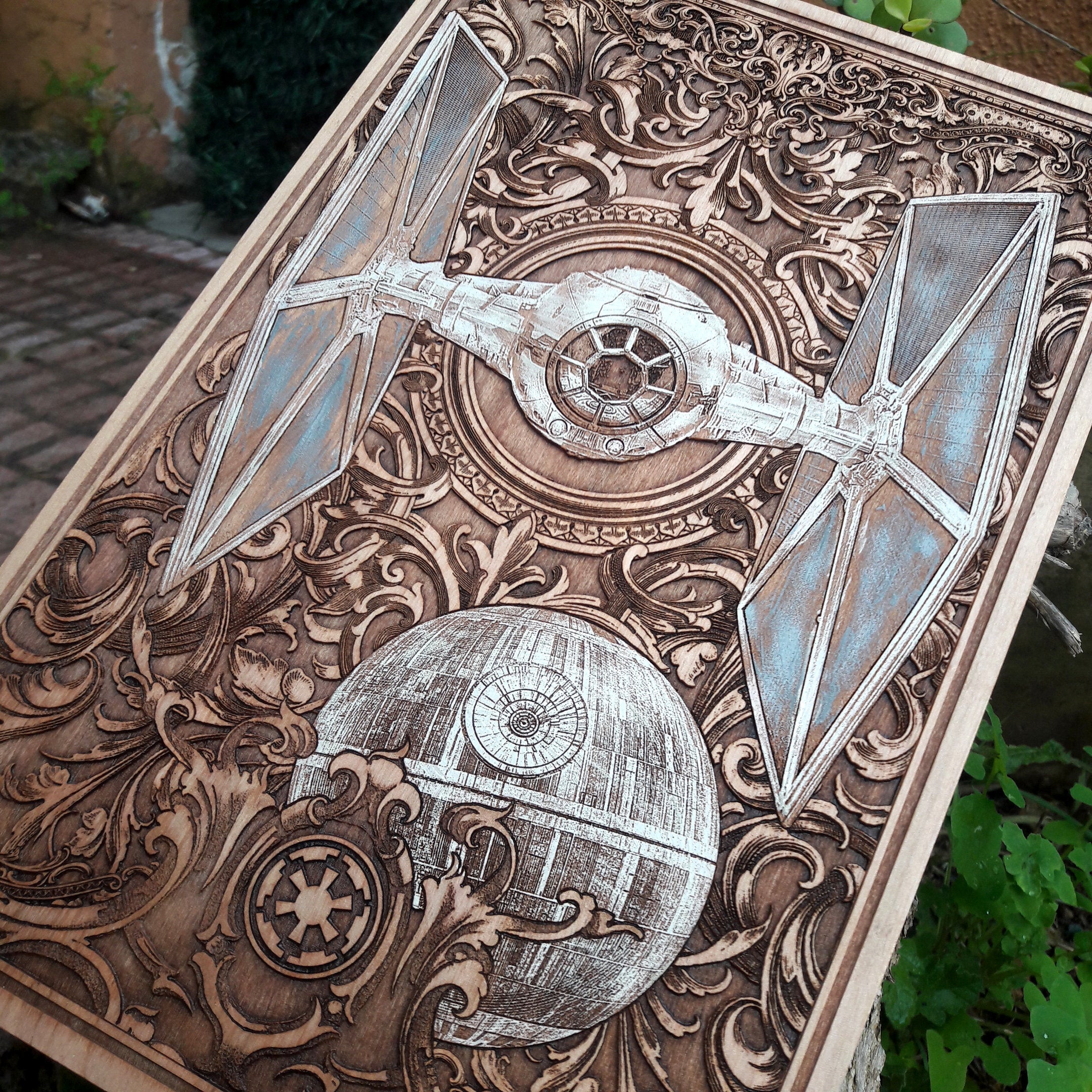 Custom wood engraving of a Tie Fighter spaceship