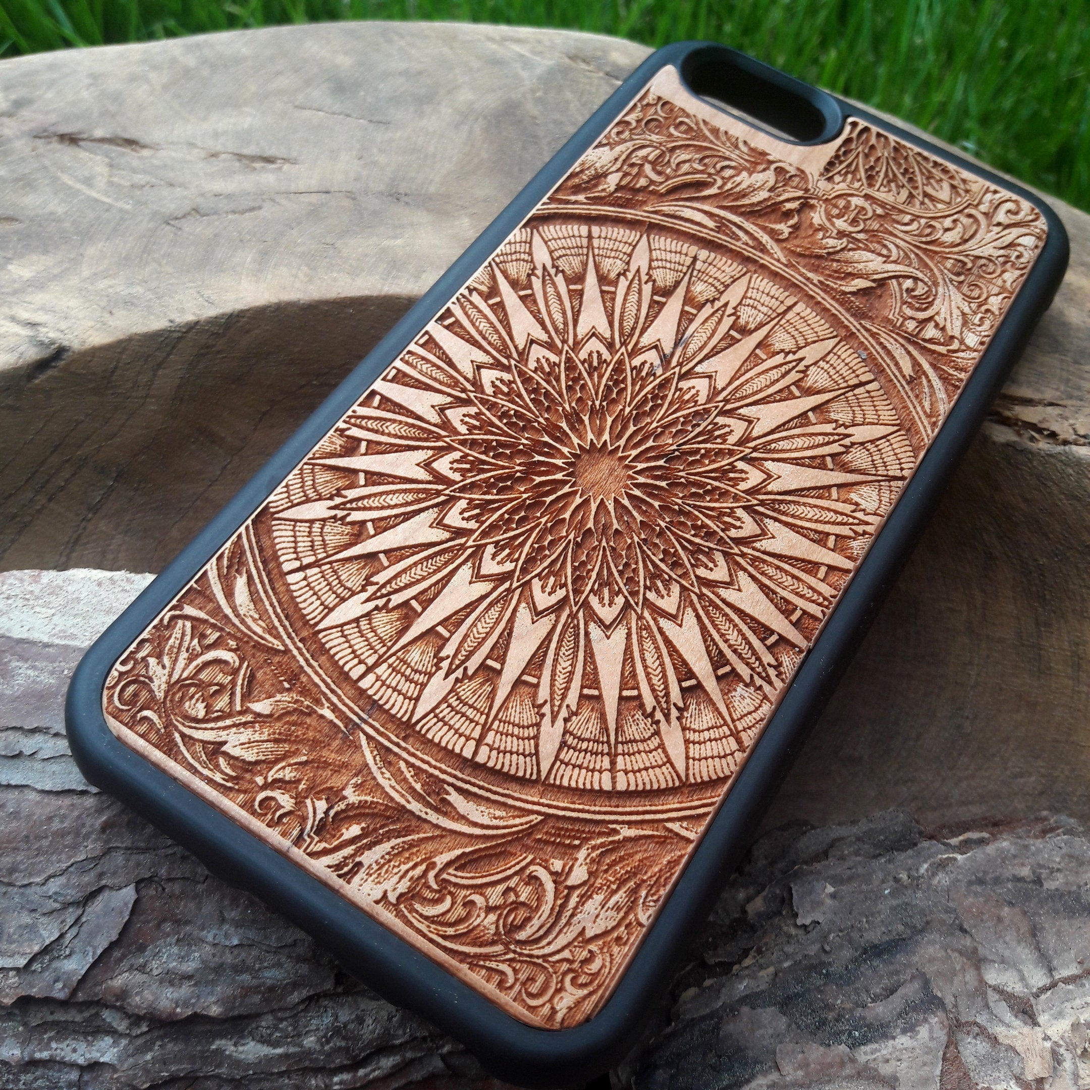 Laser-engraved wooden phone case featuring a detailed skull design, compatible with iPhone 16, iPhone 15, Galaxy S25, and more.