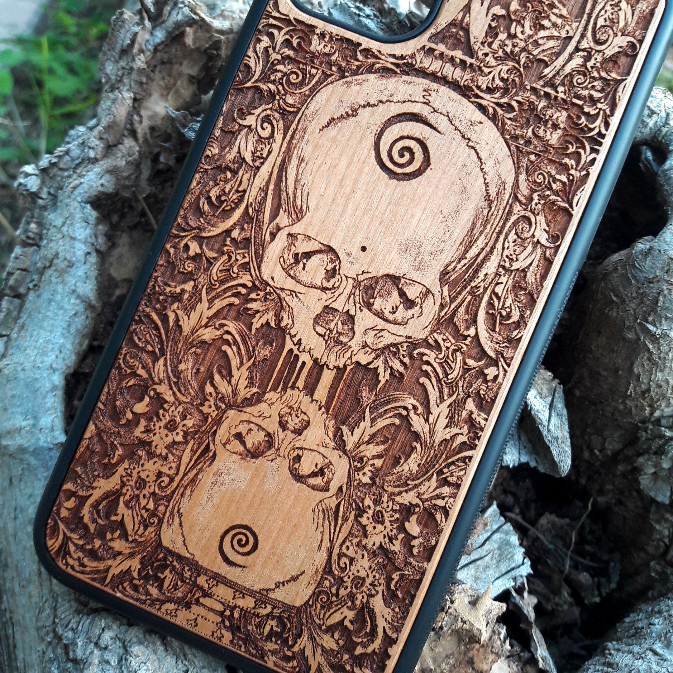 Wooden phone case with a detailed praying skeleton design, carved for iPhone , iPhone 15, Galaxy S, Galaxy S24, and other models. A gothic and artistic phone accessory, offering unique style and durable protection.