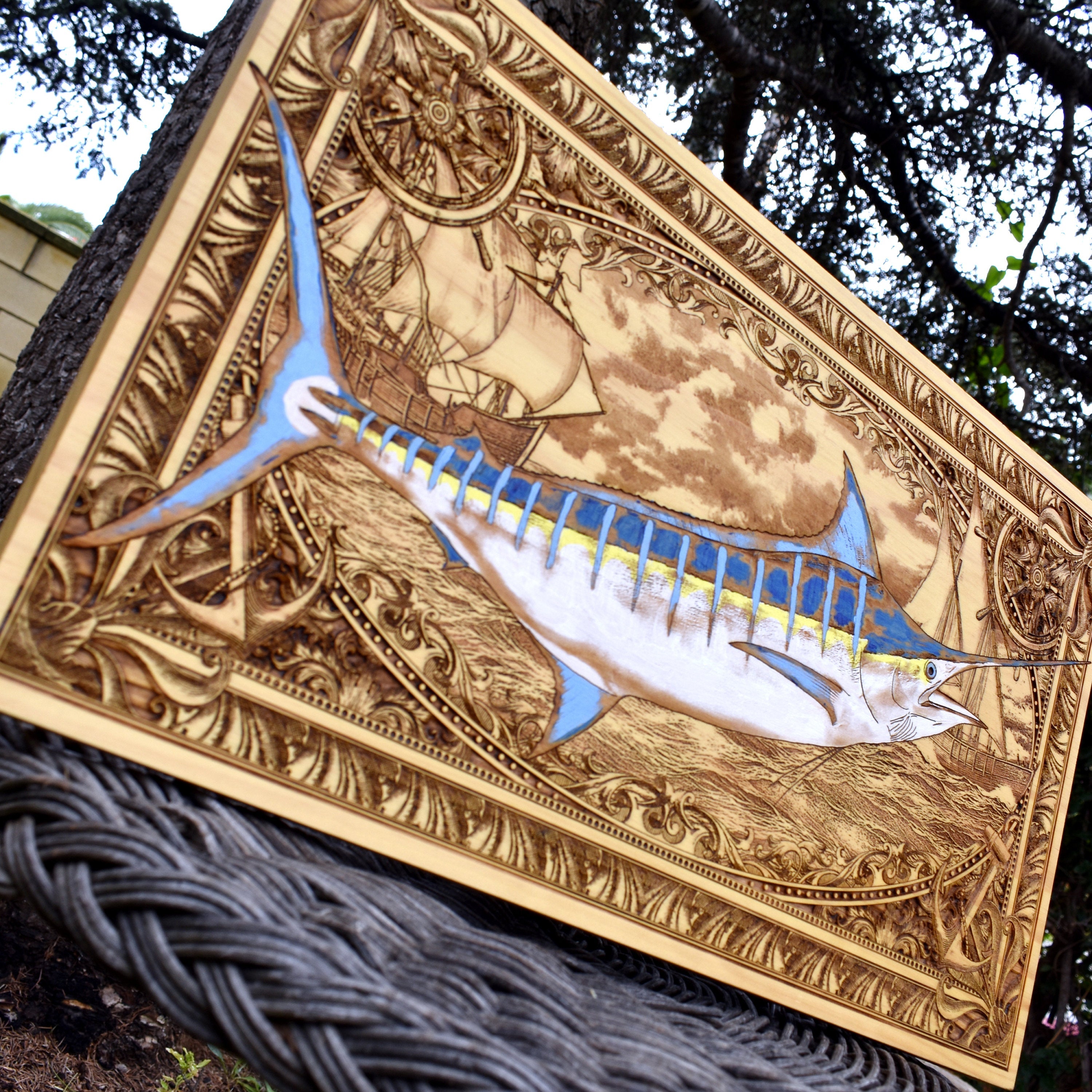 Extra-large blue marlin wood wall art, angled outdoor view highlighting the blue striped marlin
