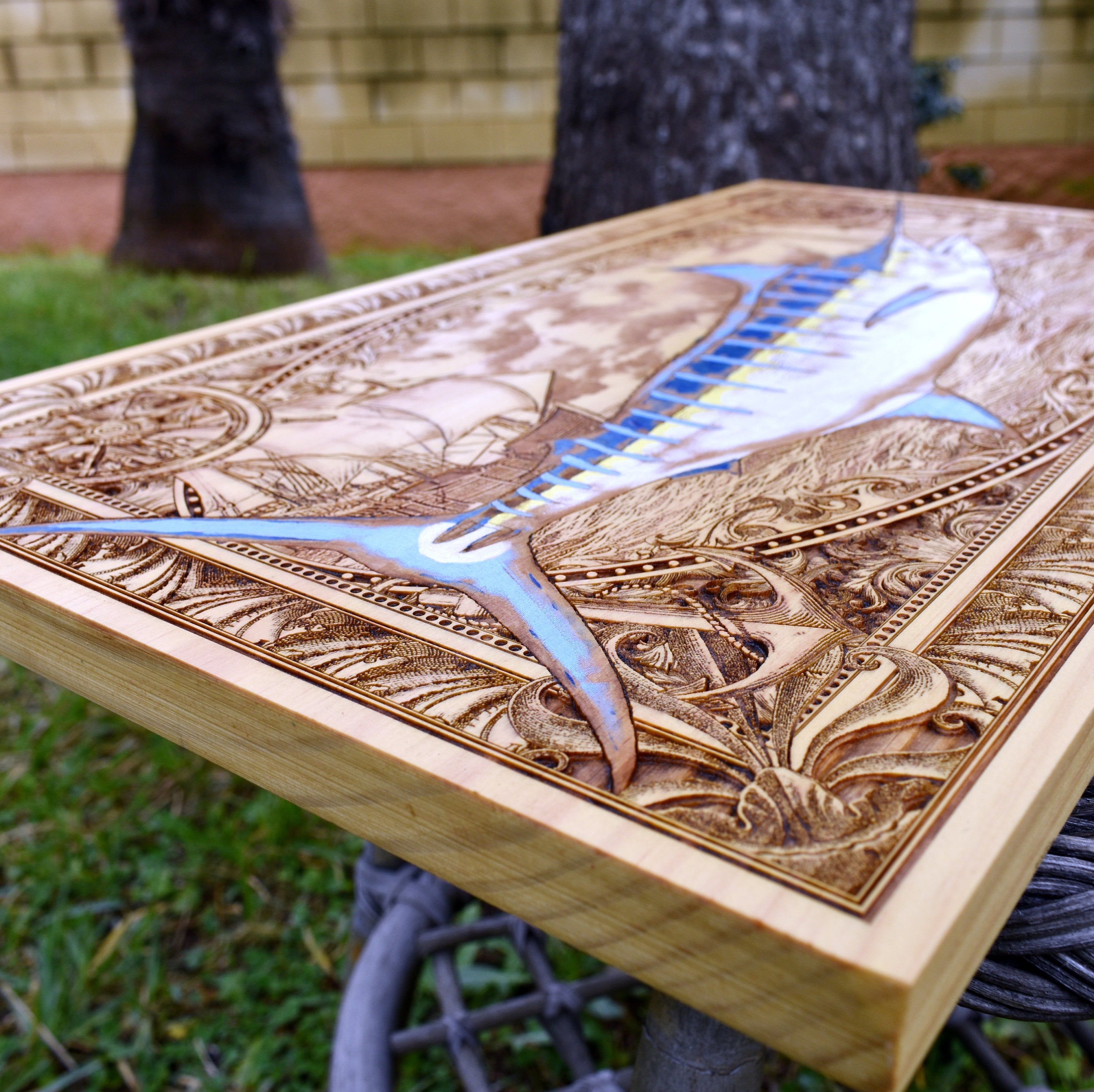 Extra-large blue marlin wood wall art, low side perspective showing the solid wood panel