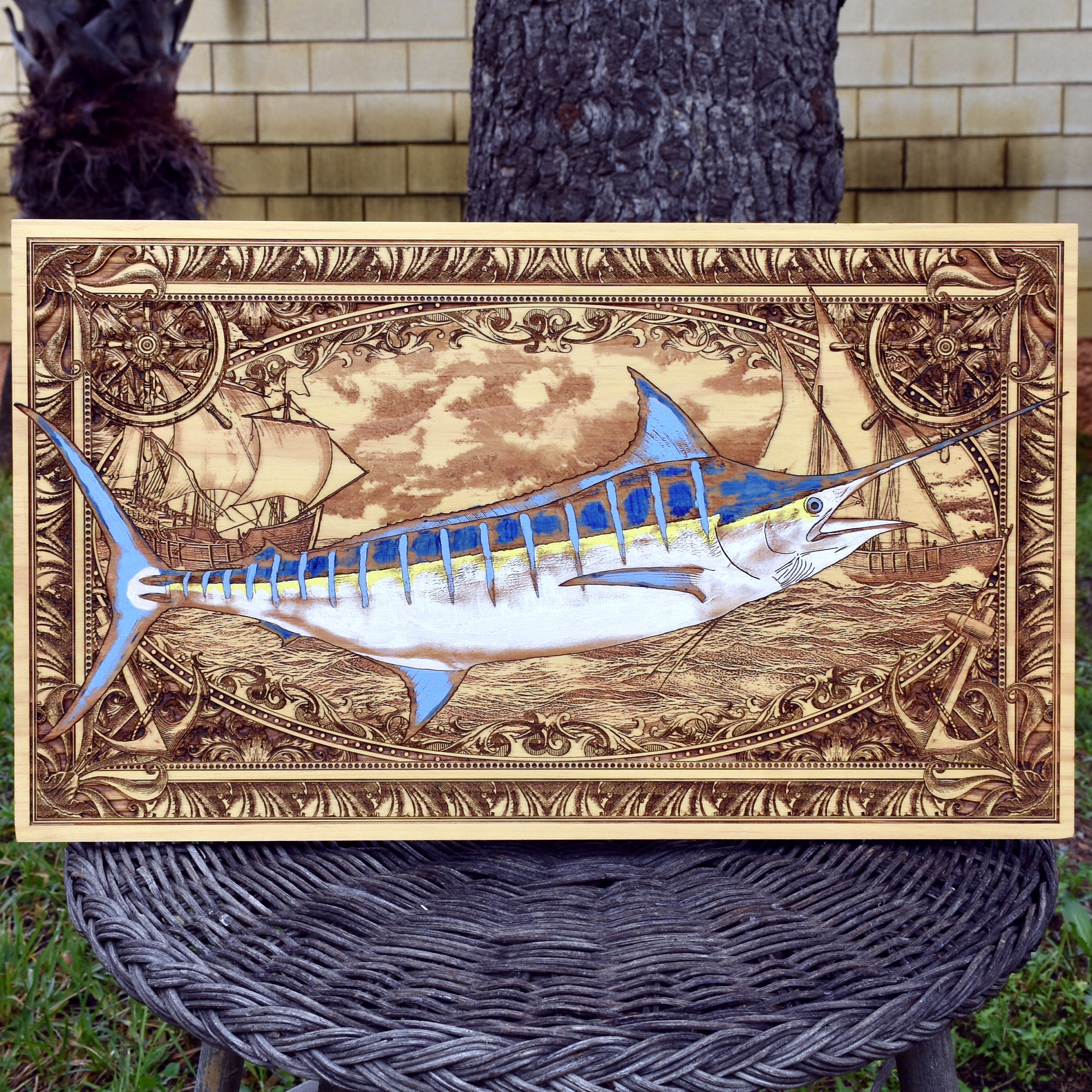 Extra-large blue marlin wood wall art, full front view of the hand-painted marlin over a seascape