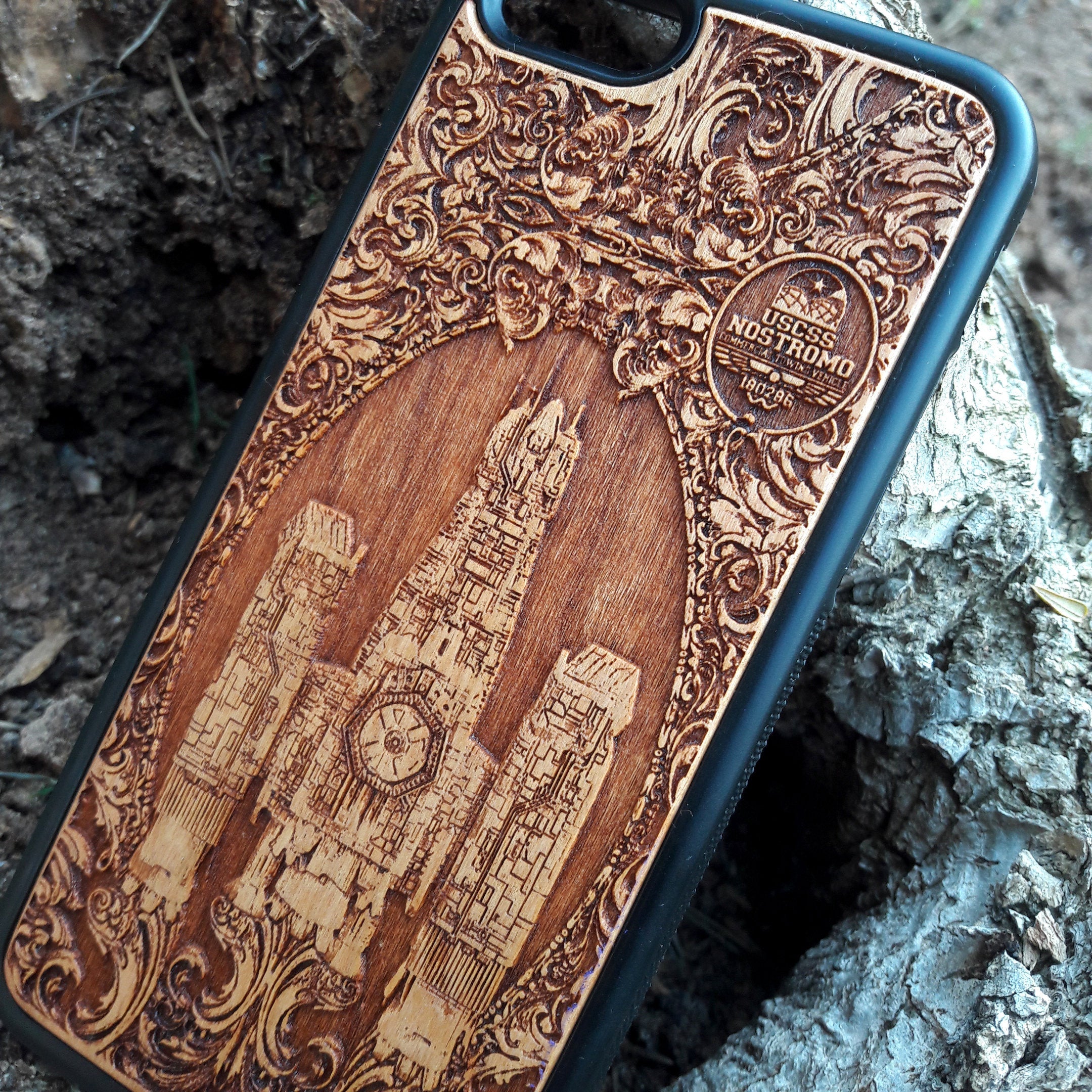 Wooden phone case with detailed Nostromo ship design from the Alien movie, engraved for iPhone , Samsung Galaxy S, and other models. Perfect for sci-fi and Alien franchise fans, offering protection and style.